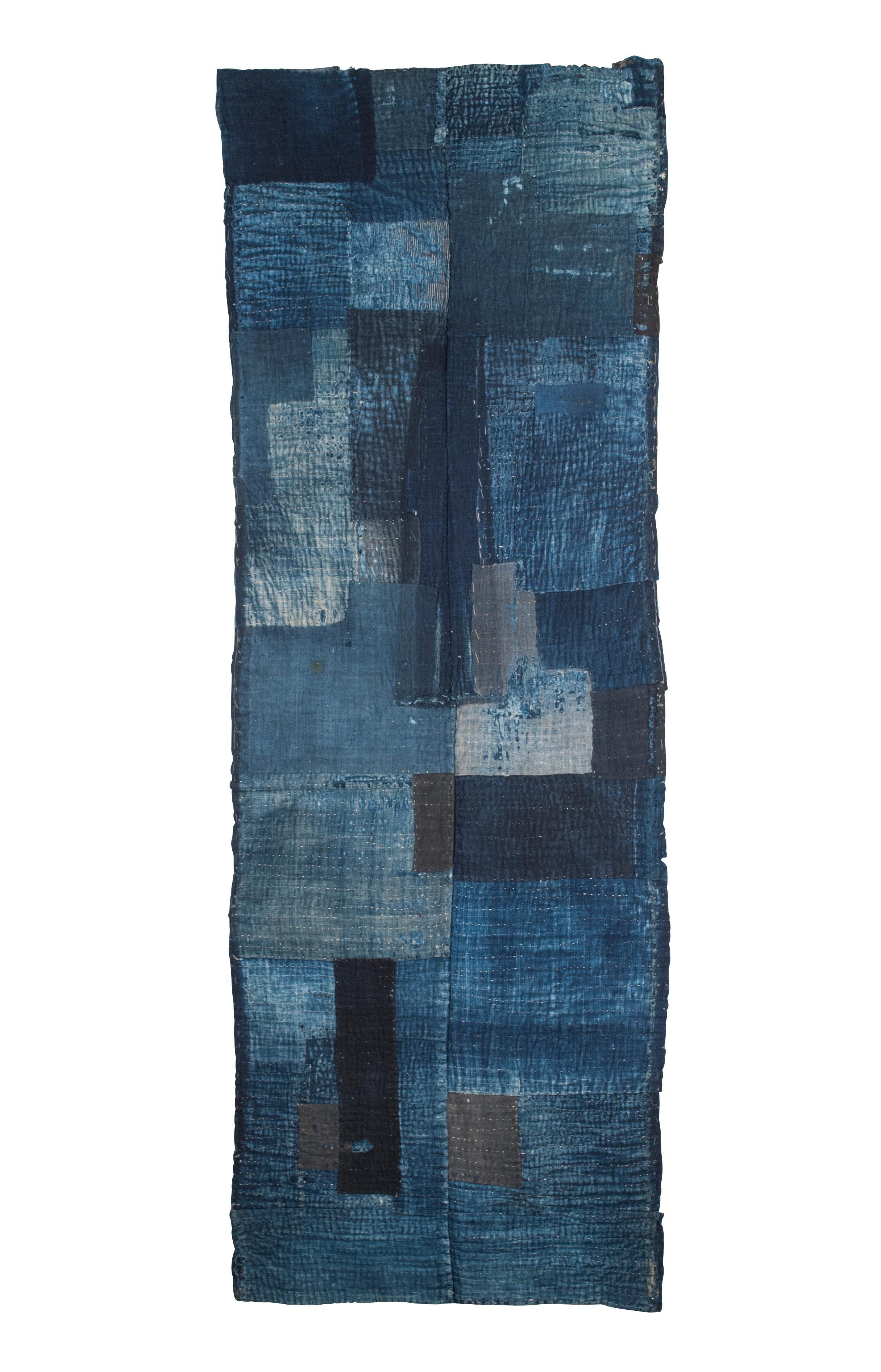 Circa 1900 Japanese 2-Panel Indigo-Dyed Patchwork Boro

This two-panel recycled patchwork cloth is made entirely of indigo dyed cotton and is likely part of a larger futon cover. A wonderful example of the resourcefulness of rural Japanese life in