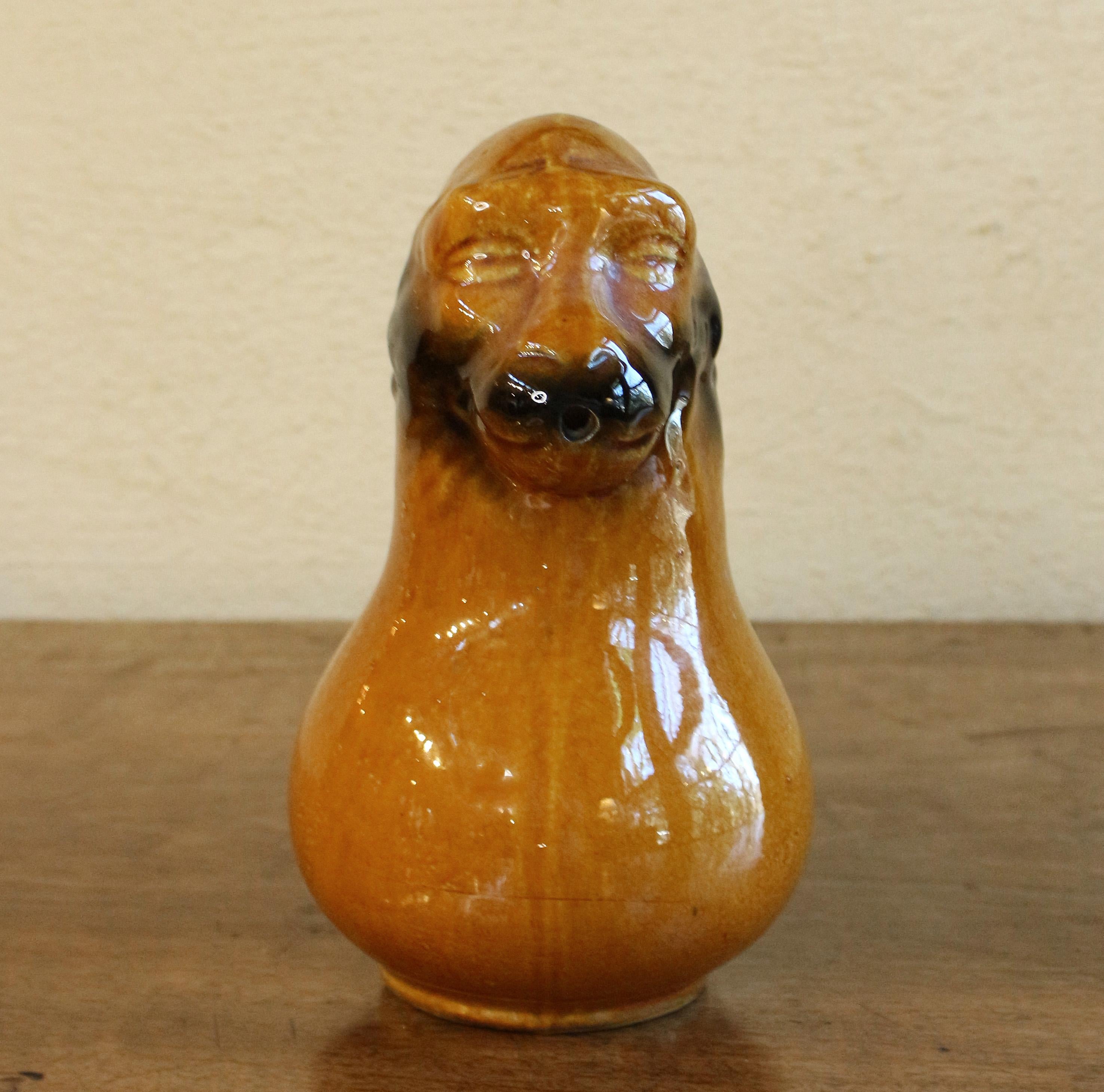 A funky monkey majolica pitcher after a Sarregemines piece, c.1900. This is a Sarregemines color & glaze; possibly a later mass production.
8 1/4