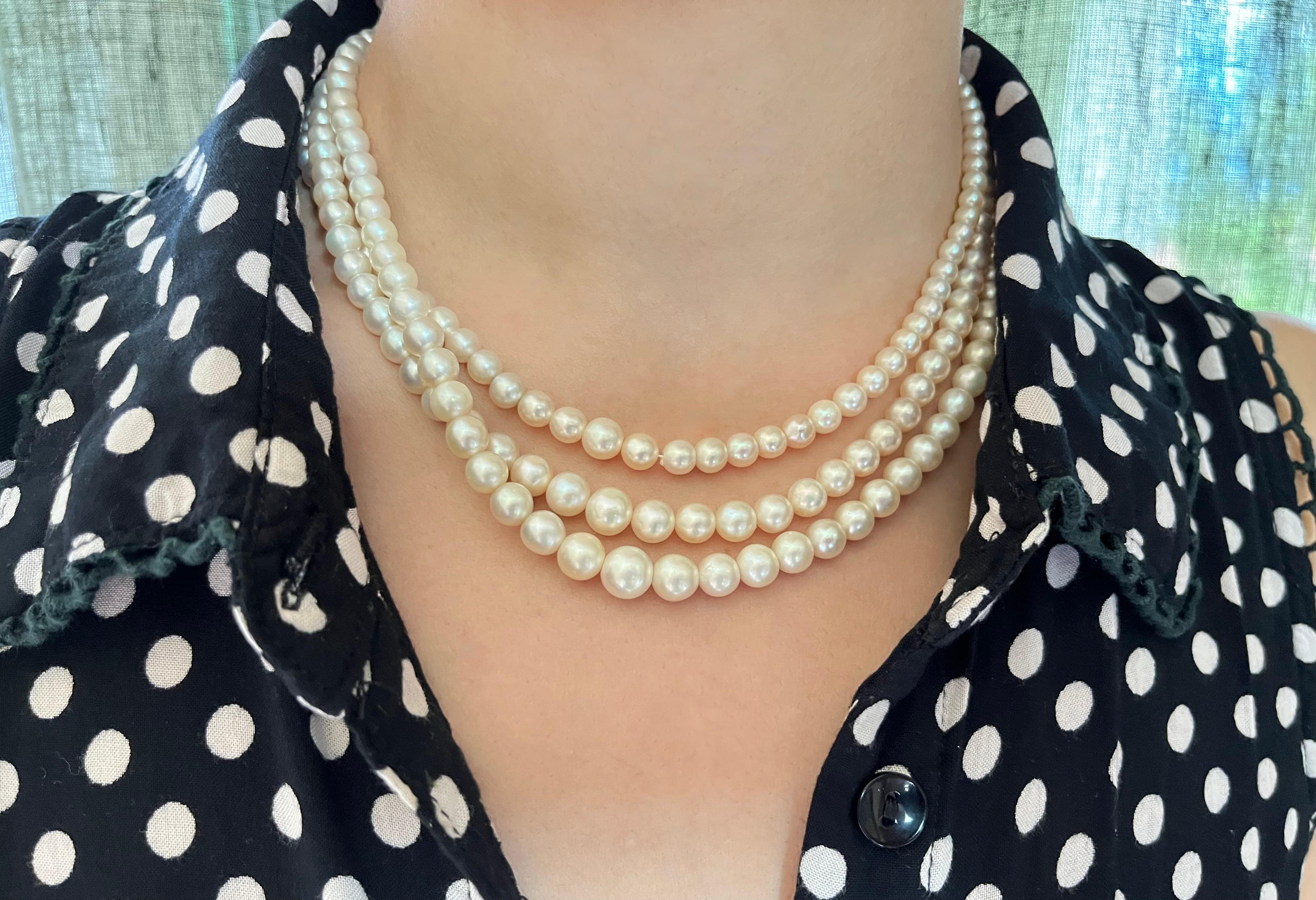 Platinum diamond natural pearl necklace circa 1900 
Three graduated strands with 245 slightly cream-coloured natural pearls of 4 to 8.5 millimeters, joined by an oval clasp set with 18 old mine cut diamonds weighing approximately 2 carats
42 cm/16.5