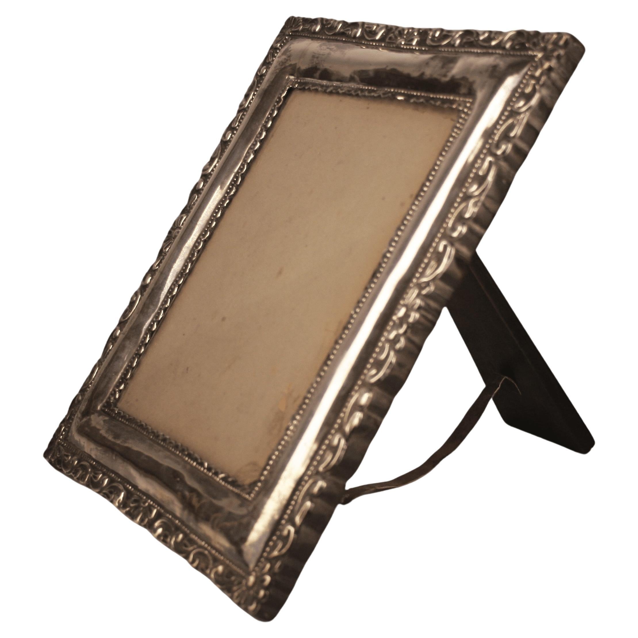 Circa 1900 Neoclassical Wooden Frame with Repoussé Silvered Metal Front Plate