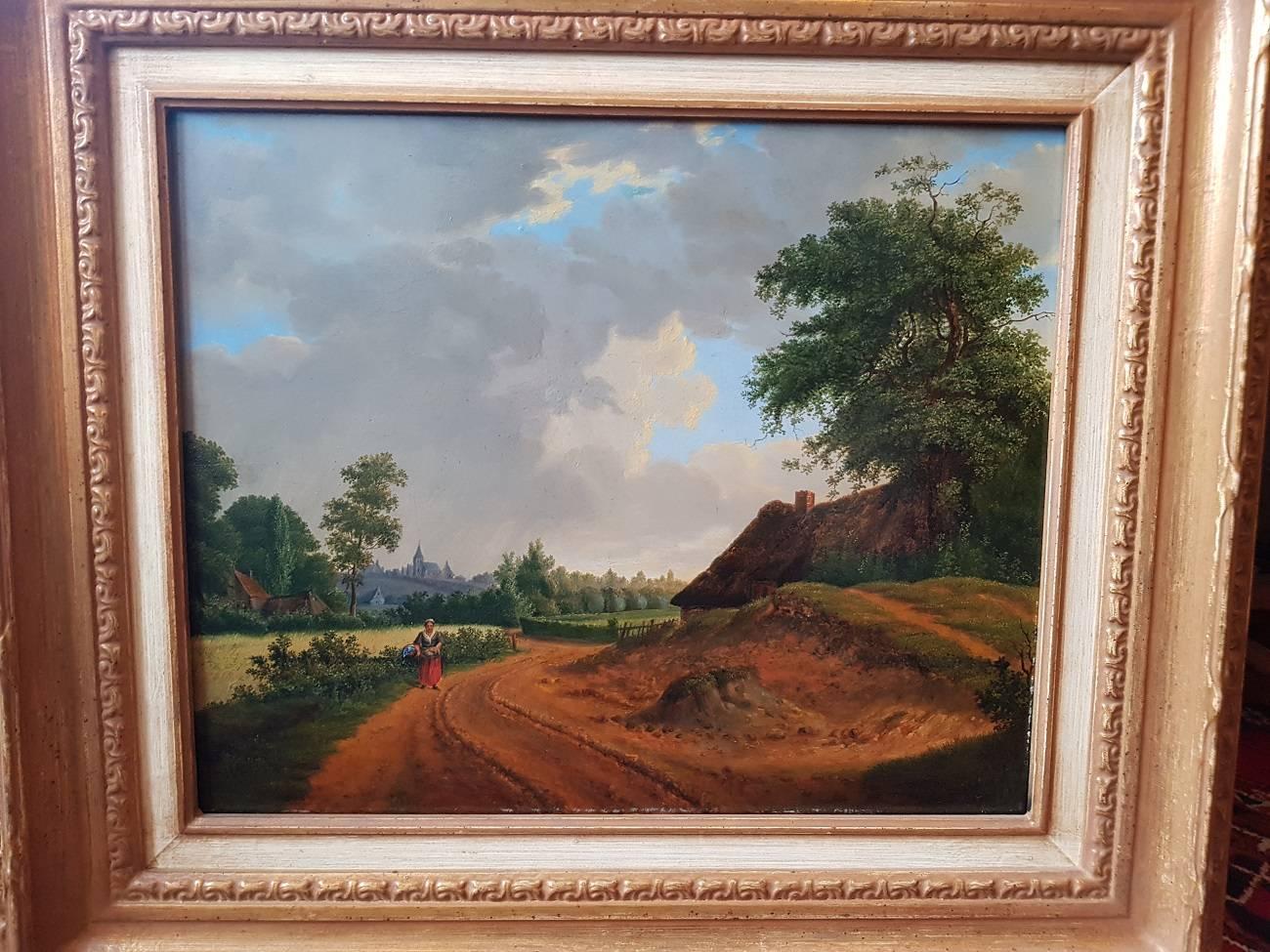 Late 19th early 20th century painting oil on panel signed with Koekkoek on the bottom of the road and obscure initials presumably H. P. Koekkoek depicting a femalefarmer on country road in a beautiful gold-colored frame.

The measurements are