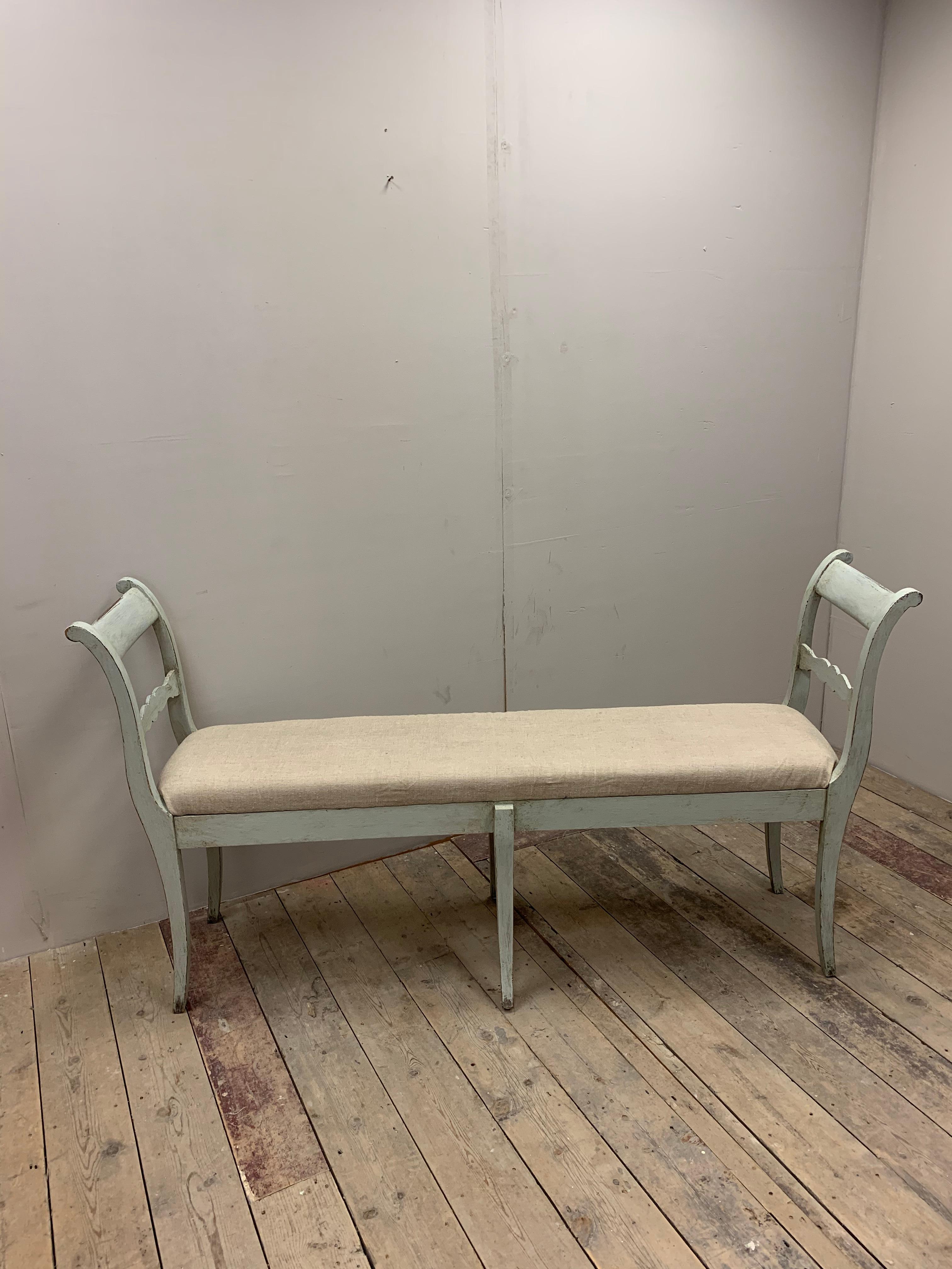 Circa 1900s Swedish well-proportioned bench or long stool. A versatile piece which has likely to have been converted from two chairs to create this interesting bench. The bench has been repainted in a light grey/blue colour and reupholstered in a