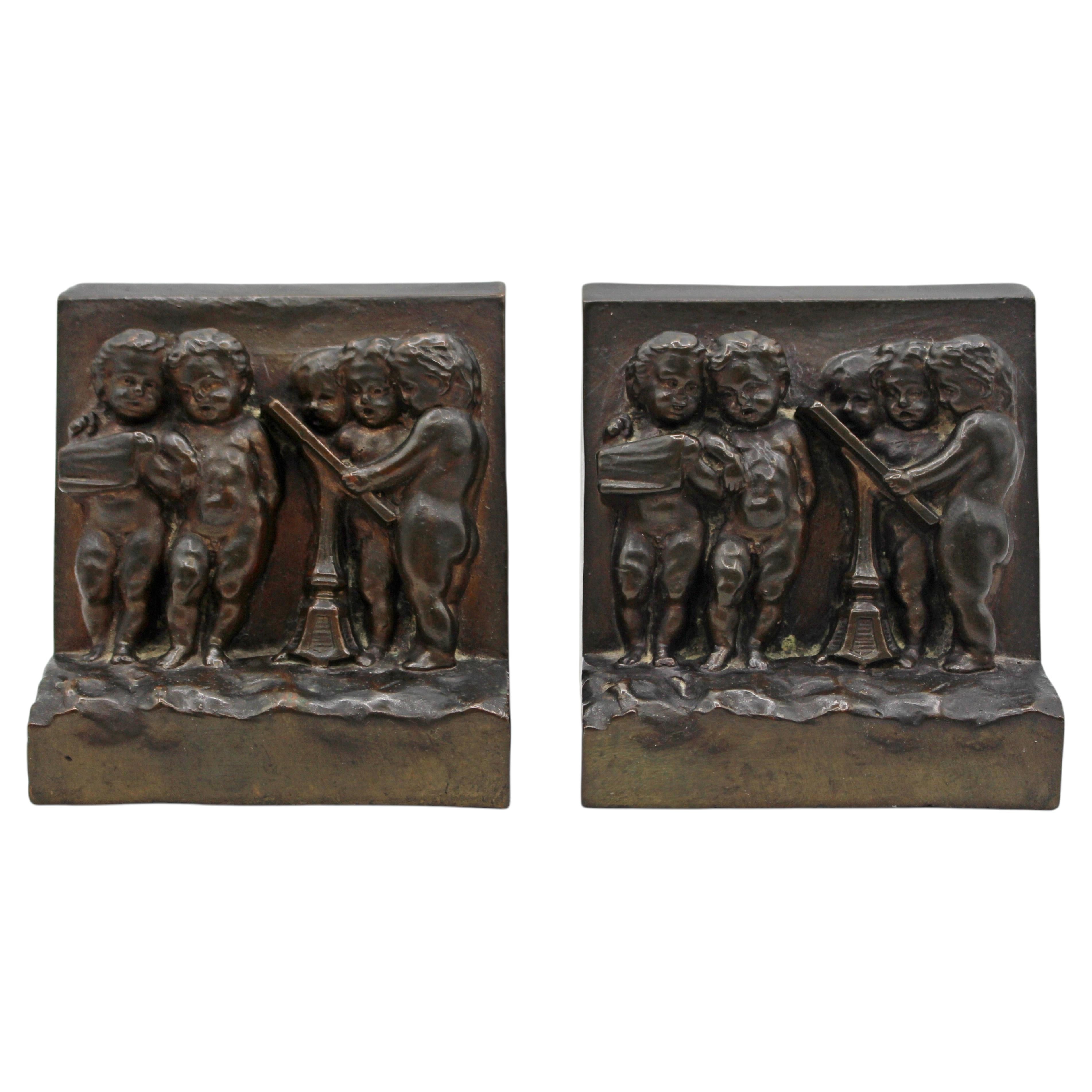 Circa 1900 Pair of Bronze Plated Bookends Featuring Reliefs of Putti