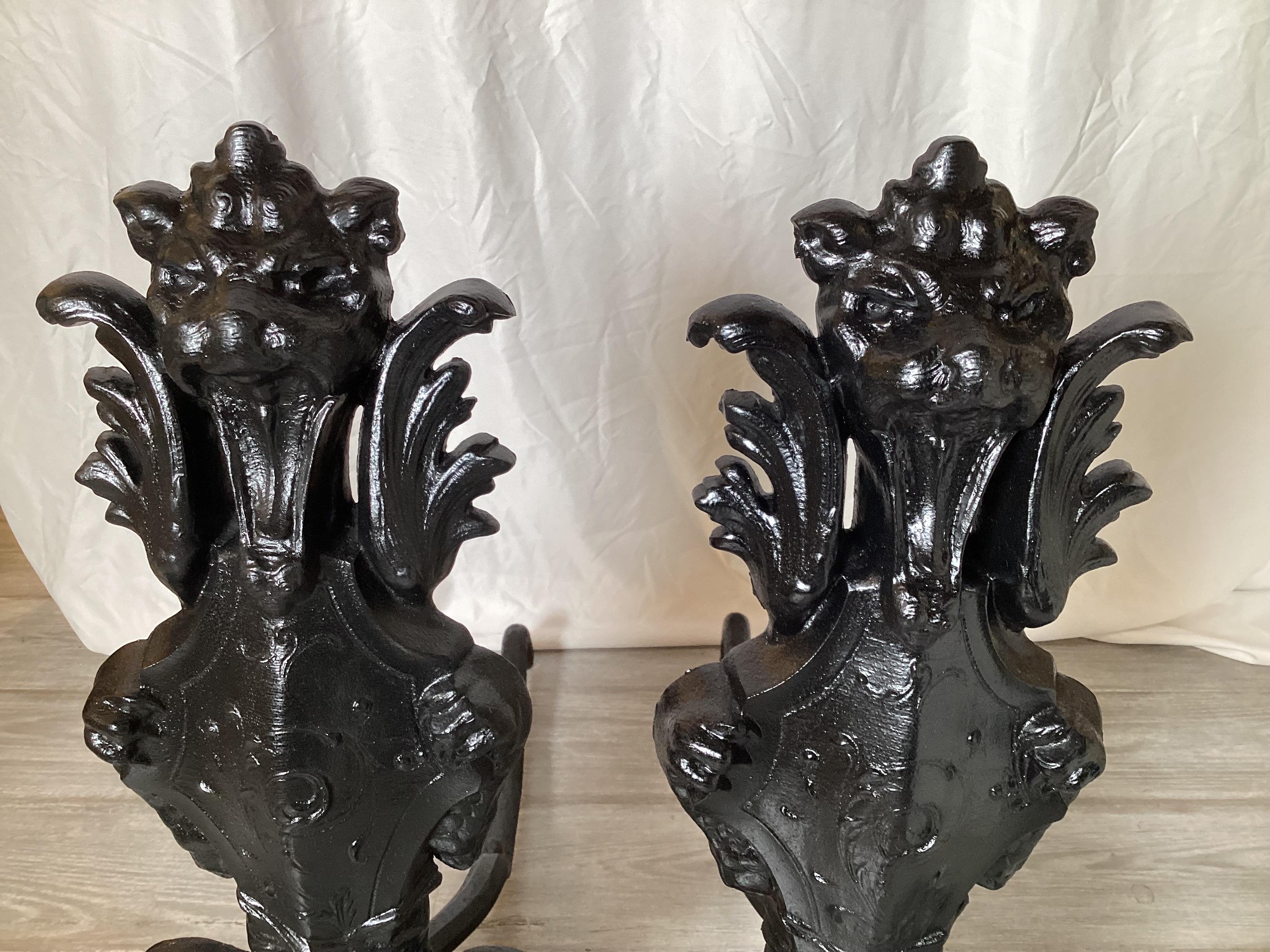 Nice pair of circa 1900's cast iron Lion motif andirons in very good original condition.  They have recently been repainted.