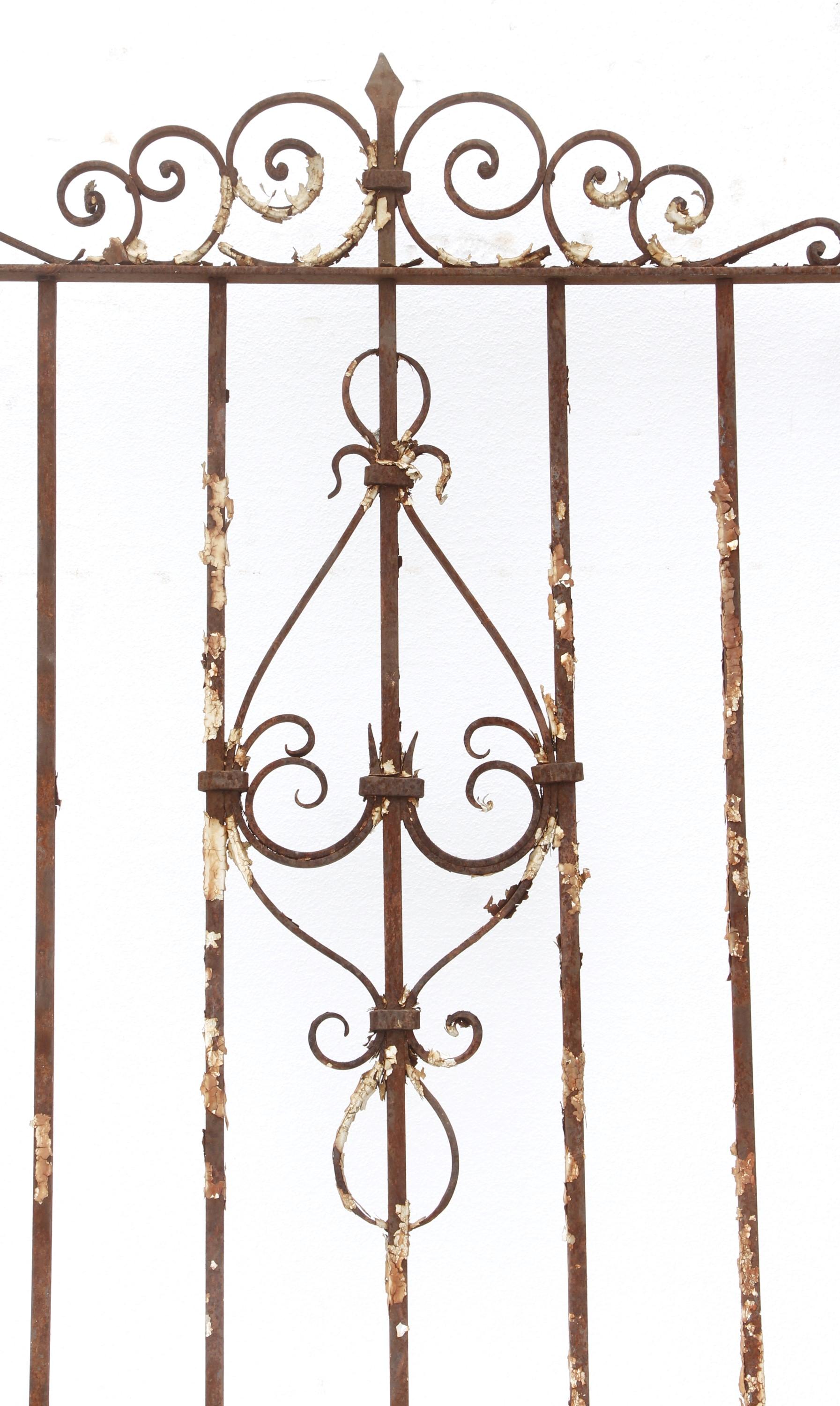 Victorian style wrought iron brownstone window guard. This ornate iron has a natural rust patina. Measures: 67.75 x 39.5. Please note, this item is located in our Scranton, PA location.
