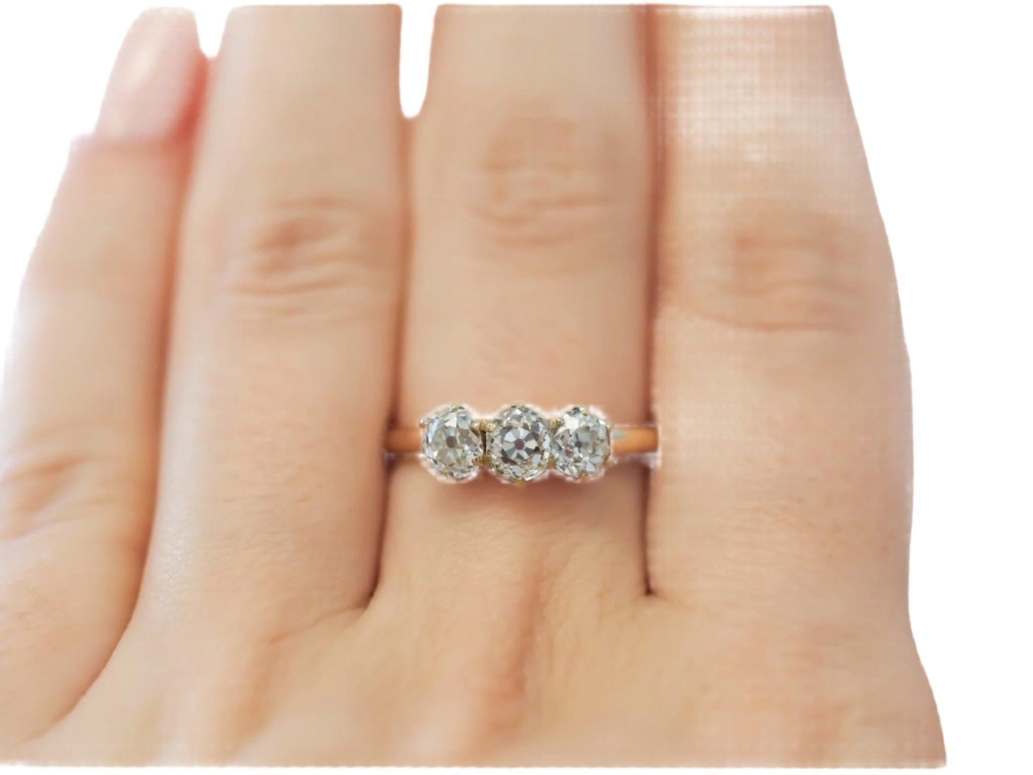 Circa 1900s 1.25cttw Old European Brilliant Diamond Three Stone Engagement Ring In Good Condition For Sale In Hicksville, NY