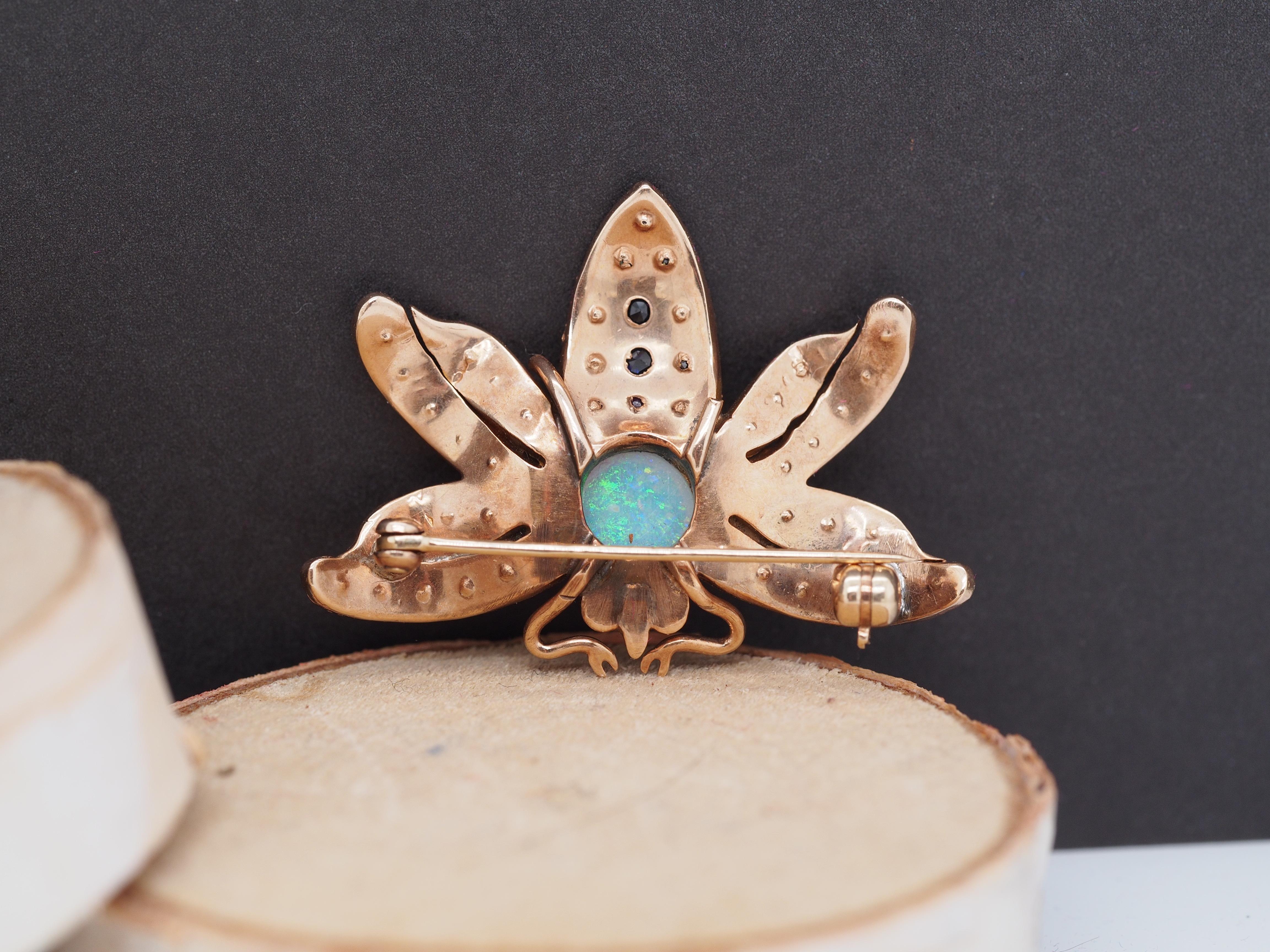 Antique Cushion Cut Circa 1900s 14K Yellow Gold Opal, Diamond, Sapphire and Ruby Butterfly Brooch For Sale