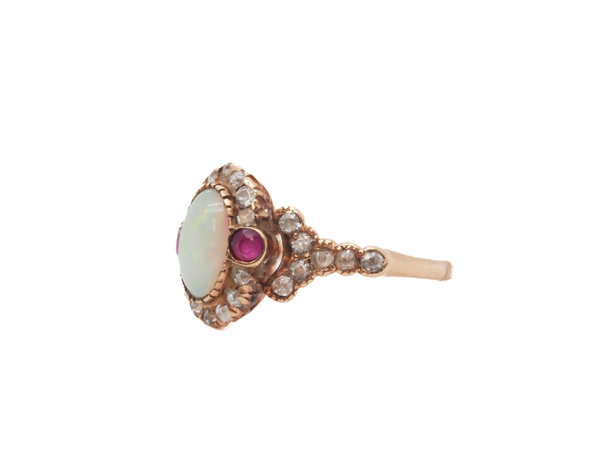 Circa 1900s 14K Yellow Gold Opal, Ruby, and Old Mine Diamond Ring

Item Details:
Year: 1900s
Ring Size: 7
Metal Type: 14K Yellow Gold [Hallmarked, and Tested]
Weight: 3.5 grams

Opal Details: 8.5mm x 4mm, Natural Opal

Diamond Details: Natural, Old