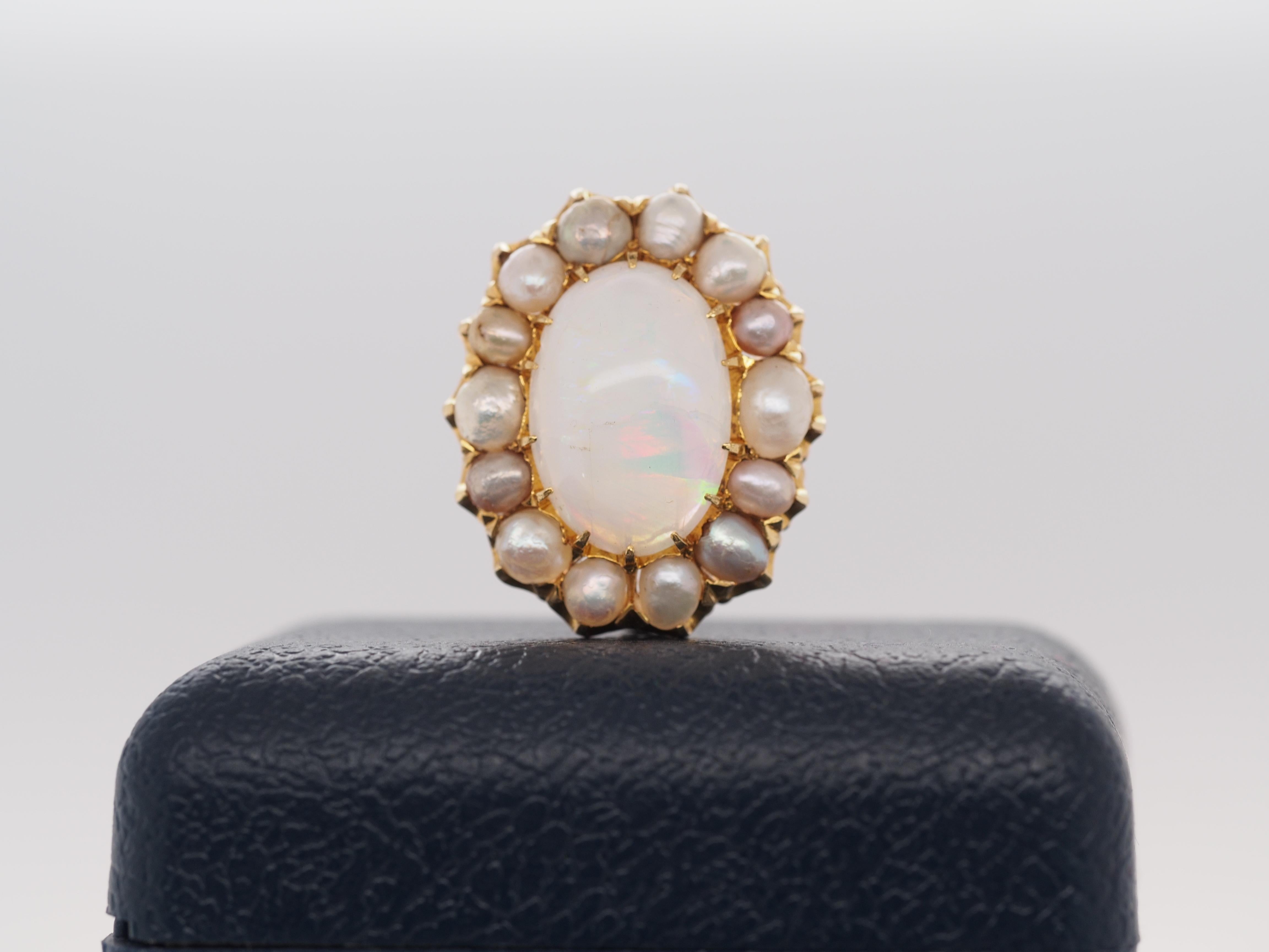 Item Details:
Metal Type: 20K Yellow Gold [Hallmarked, and Tested]
Weight: 7.5 grams
Center Opal Details:
Measurement: 11mm x 17.5mm x
Cut: Oval Cabochon
Color: Orange, Pink, Red, Green
Side Pearl Details:
Type: Natural, Saltwater pearls
Weight: