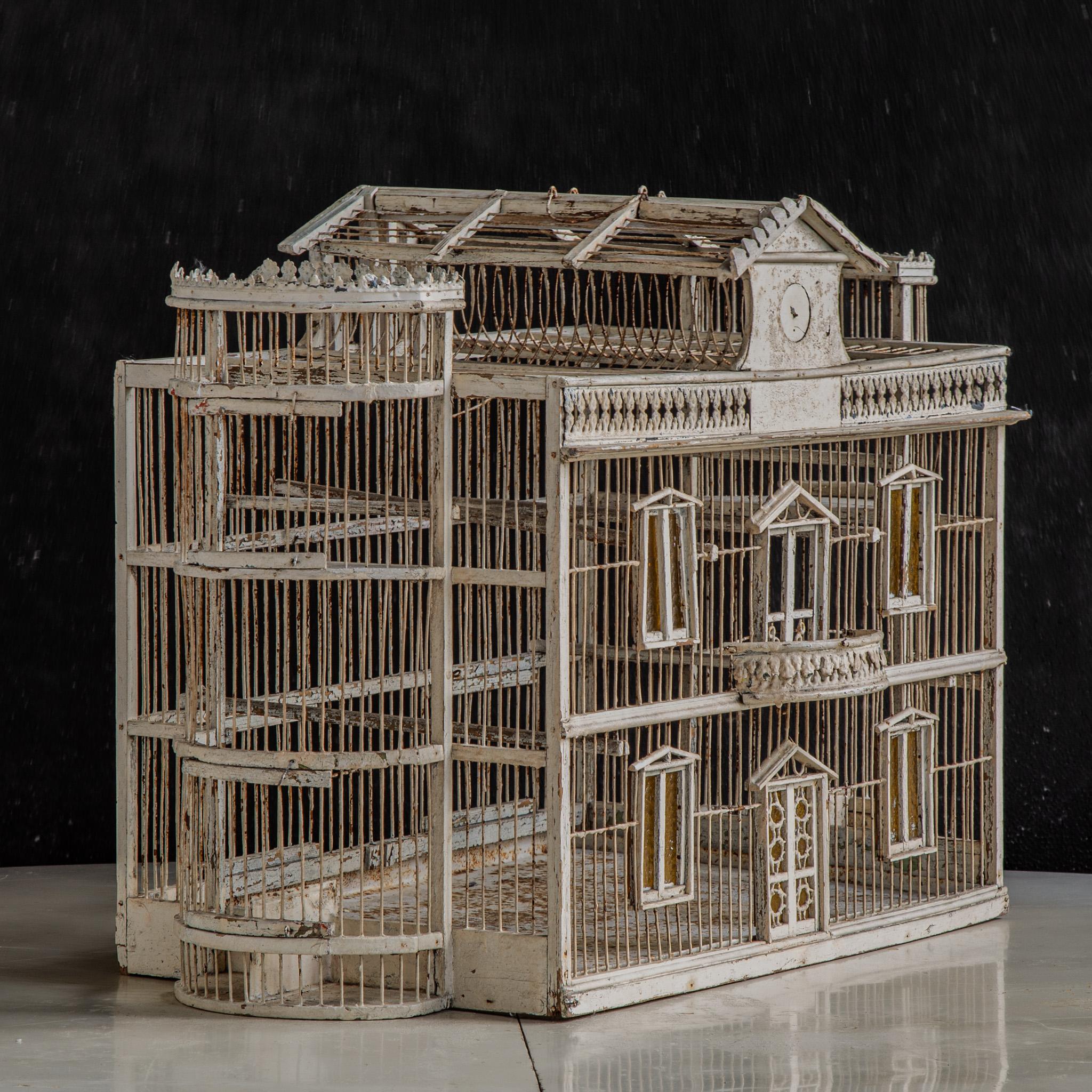 1900's Italian Provincial Style Decorative Bird Cage with Yellow Stained Glass Windows. Crafted in Italy, this piece offers a blend of rustic charm and delicate artistry, suitable for various decorative preferences.
