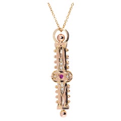 Circa 1900s Antique Edwardian Ruby and Seed Pearl 9 Carat Rose Gold Pendant
