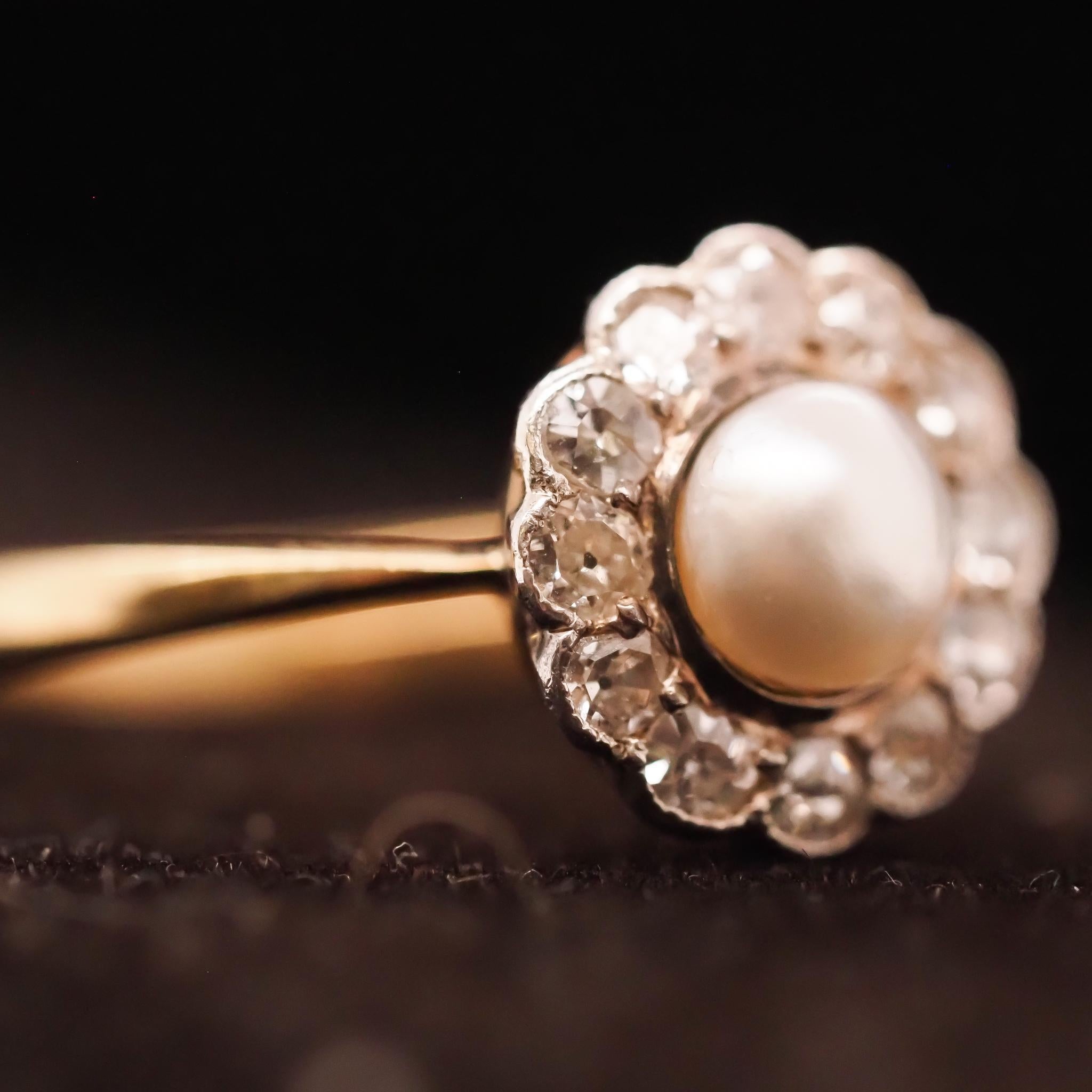 Year: Early 1900s
Item Details:
Ring Size: 6.75
Metal Type: [Hallmarked, and Tested]
Weight: 3.0grams
Diamond Details: Old European Brilliant, .25ct total weight, G Color, VS Clarity.
Pearl Details: Natural Pearl, 5.5mm, Pinkish Luster
Band Width: