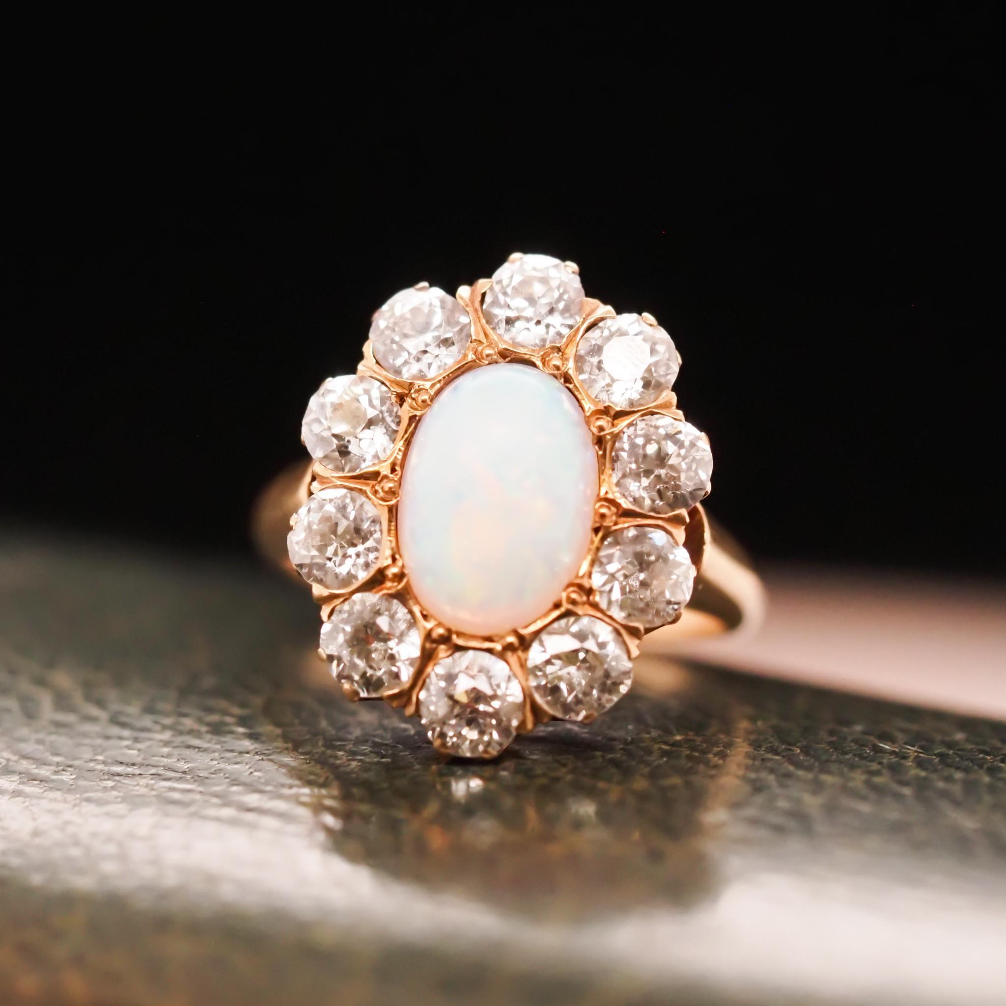 Item Details:
Year: 1900s
Ring Size: 5 (Sizable)
Metal Type: 14K Yellow Gold [Hallmarked, and Tested]
Weight: 5.0grams
Opal Details: Australian Opal, All Colors in color play, 9x6mm
Side Stone Details: 2.20ct total of Old European Brilliant