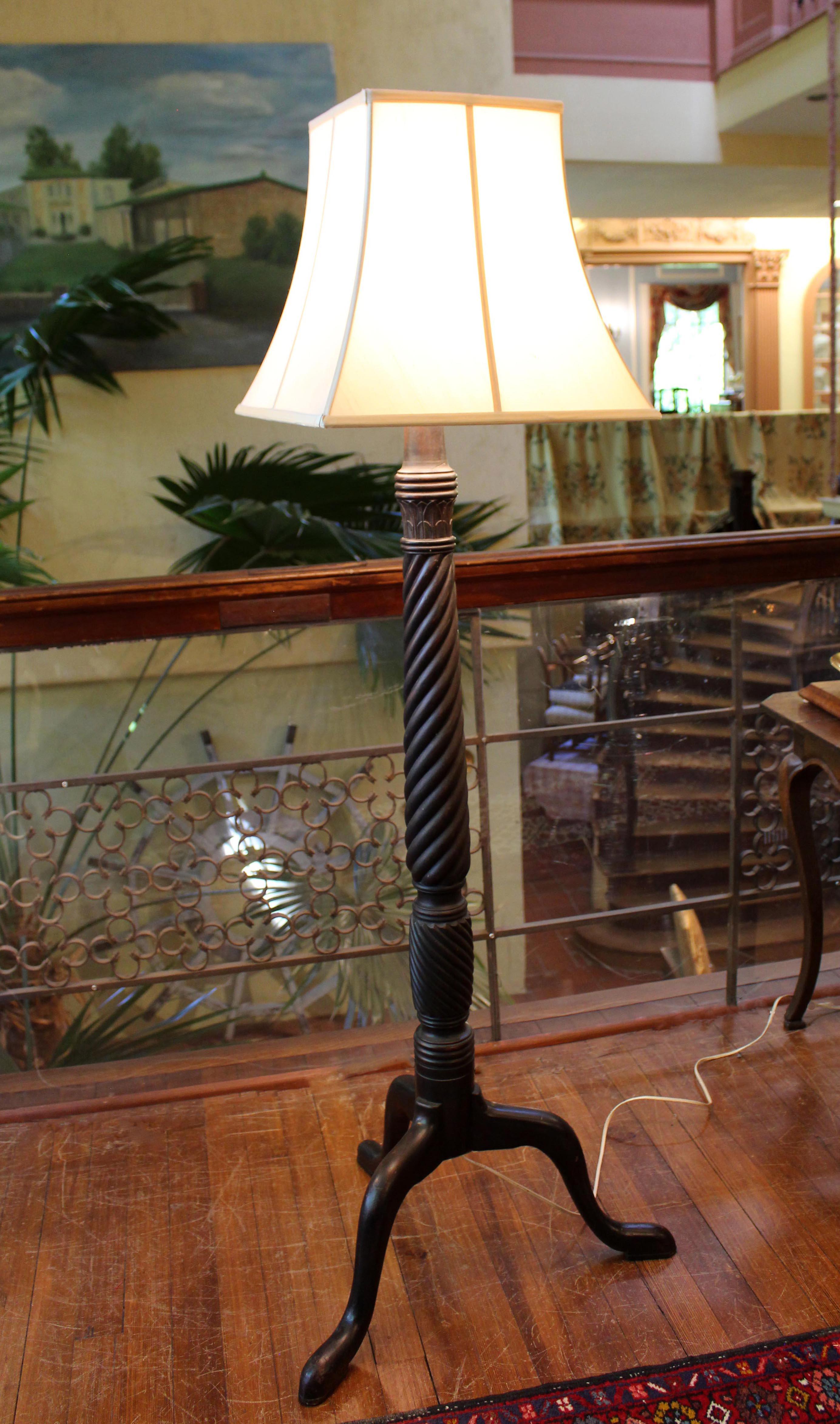 Floor lamp created c.1900 from and 1820s English bedpost. Mahogany, well carved with various spiral turnings, circle of acanthus leaves, raised on cabriole legs to pad feet. 57