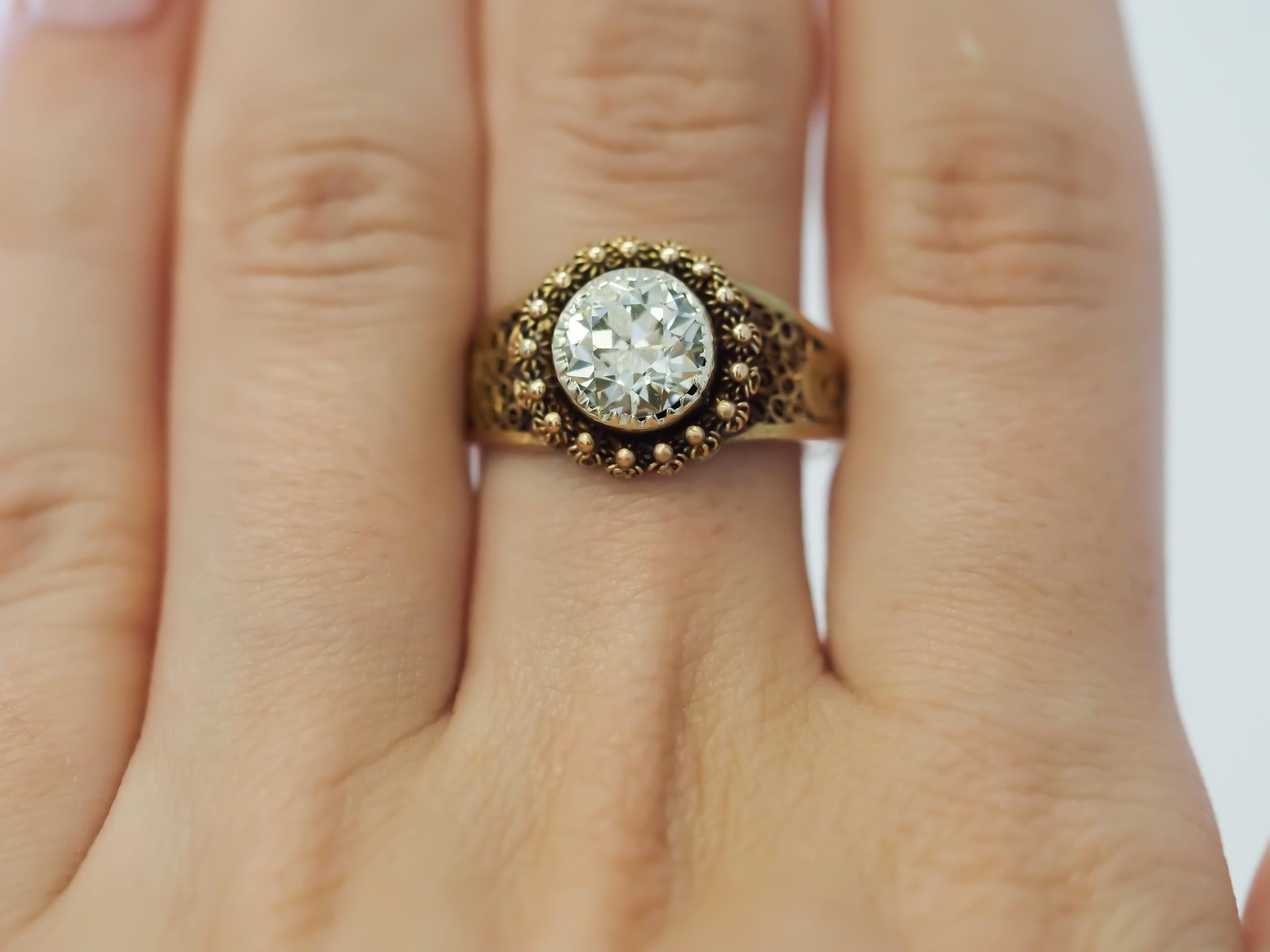 Year: 1900s
Item Details:
Ring Size: 9.5
Metal Type: 14K Yellow Gold [Hallmarked, and Tested]
Weight: 3.4 grams
Center Diamond Details:
GIA Report#:2239326445
Weight: 1.62ct total weight
Cut: Old European brilliant
Color: Light Yellow (Q-R)
Clarity: