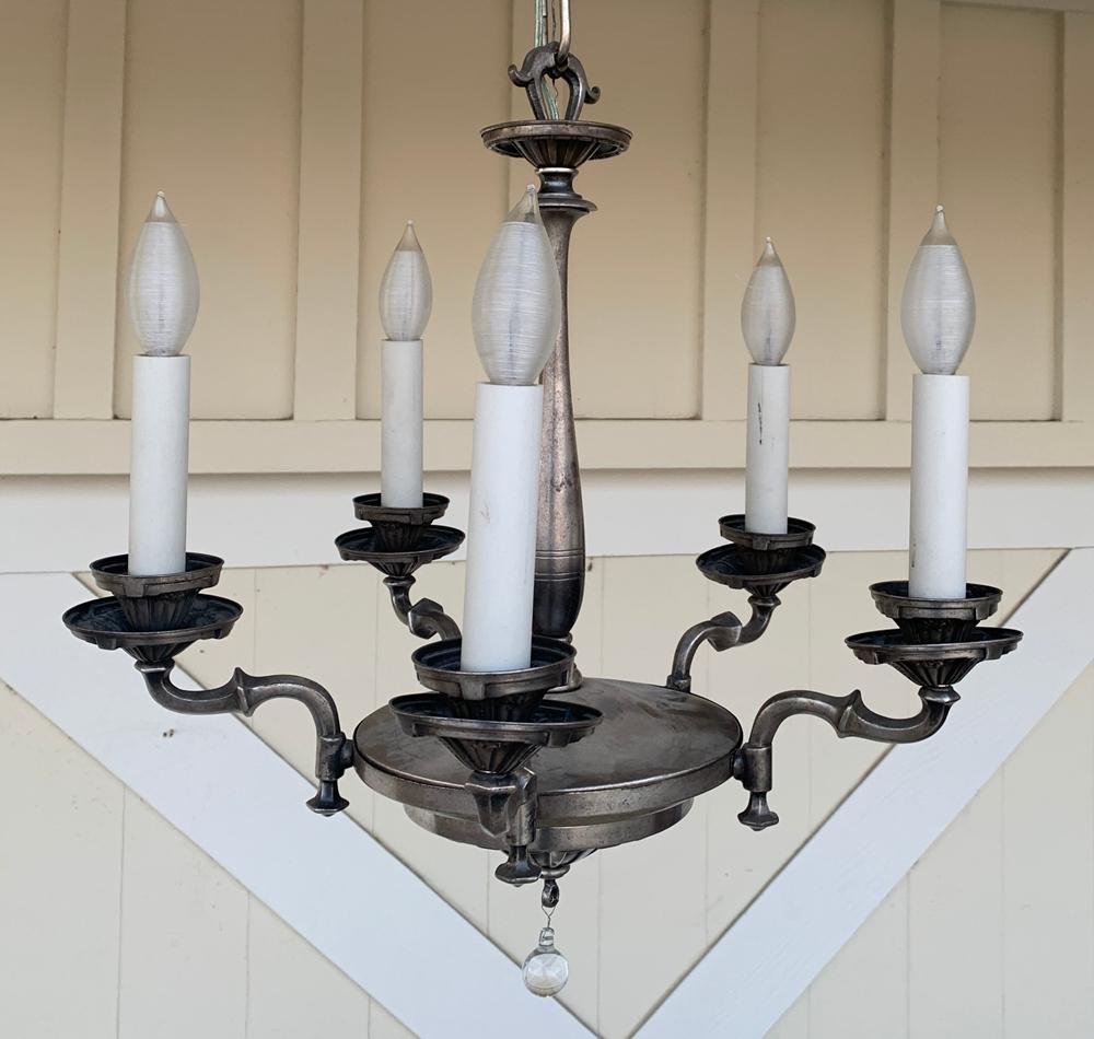 A vintage silverplate chandelier with a broad belly, five arms with beautiful details, original canopy.

The piece came from Remains Lighting.

Measurements:
32 inches high x 18 inches diameter.