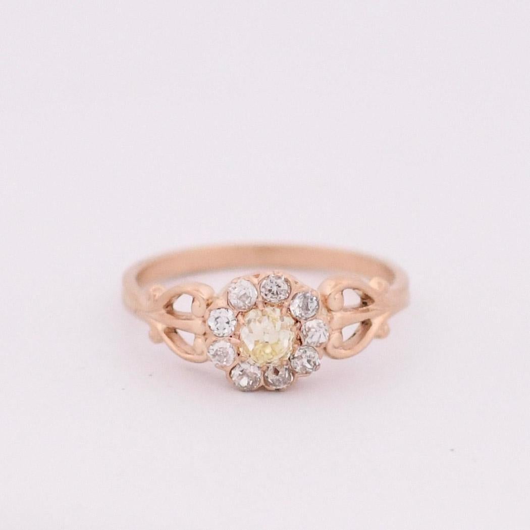 Step into the enchanting world of the Victorian era with this exquisite Flower Halo Ring, boasting a resplendent fancy yellow center diamond encircled by a halo of shimmering diamonds. The ring's design captures the essence of Victorian romance and