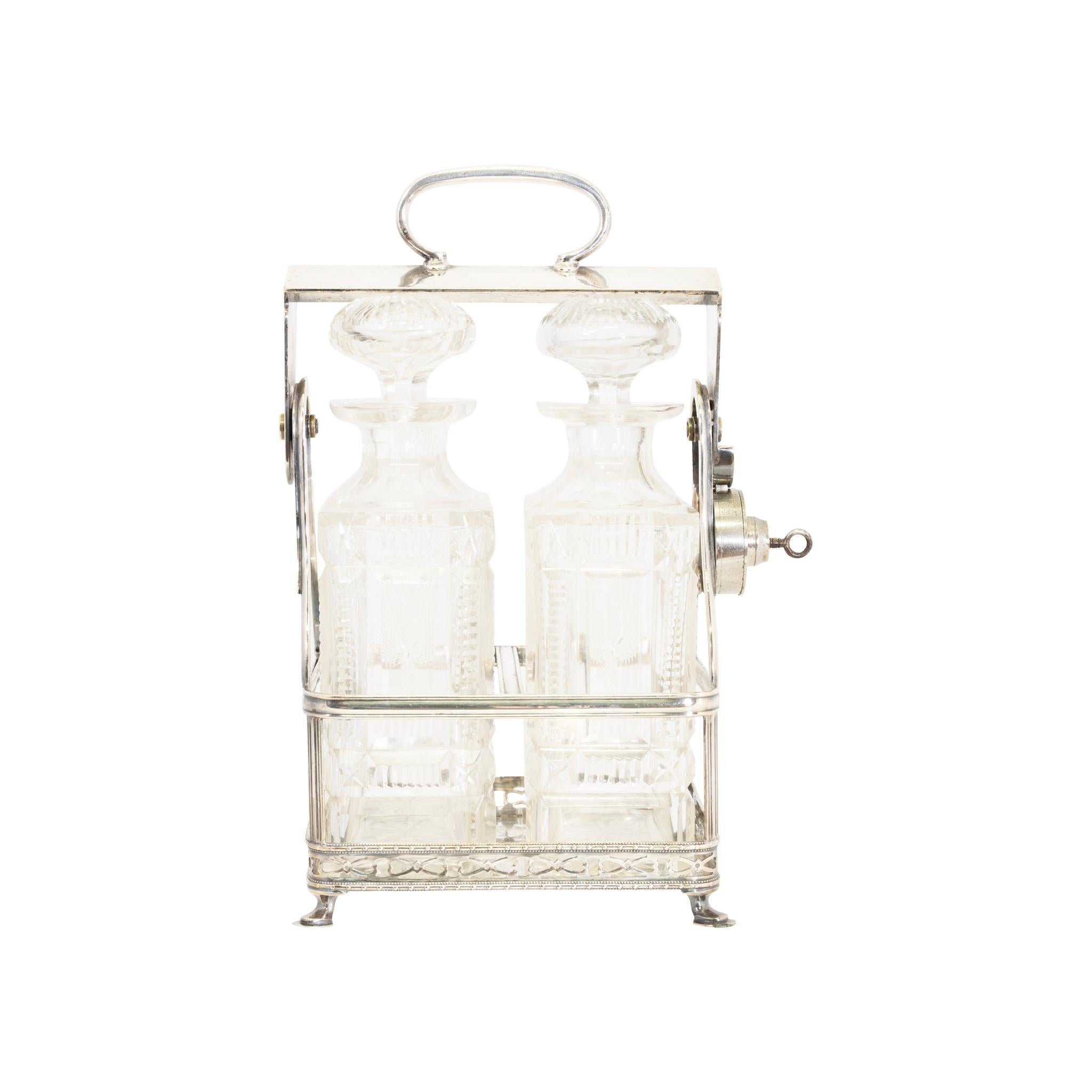Matched pair of pressed glass liquor carafes in chrome carrier with lock - safe from the butler and maid. From a ranch in Montana.

PERIOD: First quarter 20th Century
ORIGIN: Montana
SIZE: 5