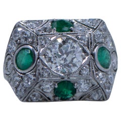 Circa 1901 Edwardian Platinum Old Mine Cut Center with Natural Emerald Accents