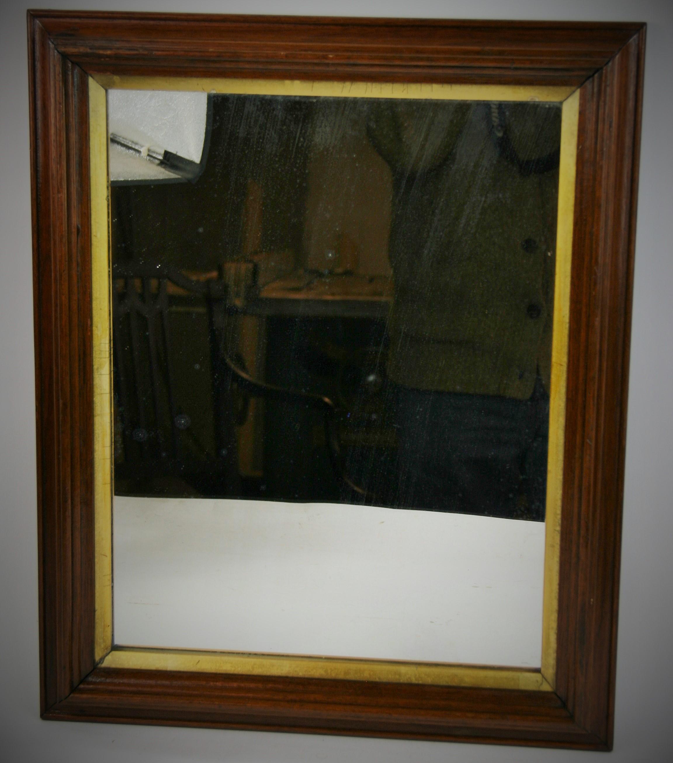 3-438 walnut mirror with gold liner, circa 1910.