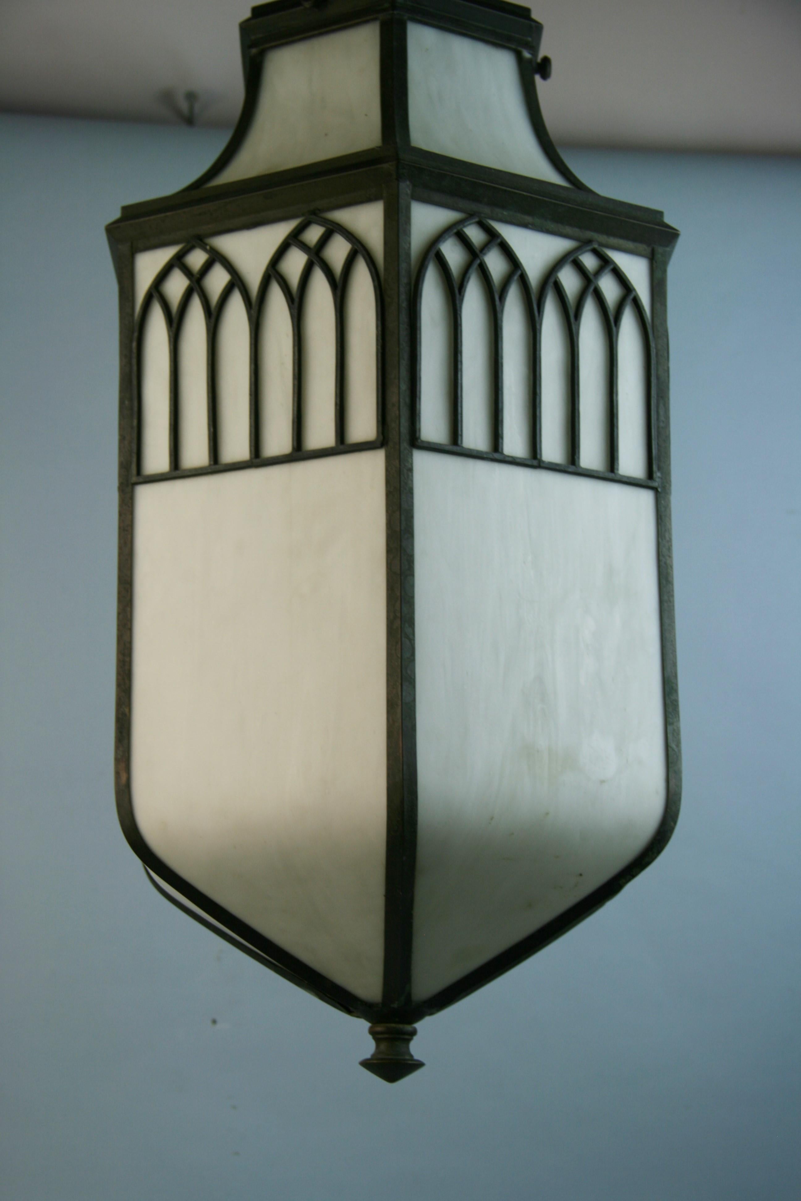 Bronze Circa 1910's Oversized Bent Glass Lantern For Sale