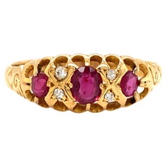 Antique Circa 1910s Edwardian Oval Ruby and Diamond Ring in 14 Karat Yellow Gold
