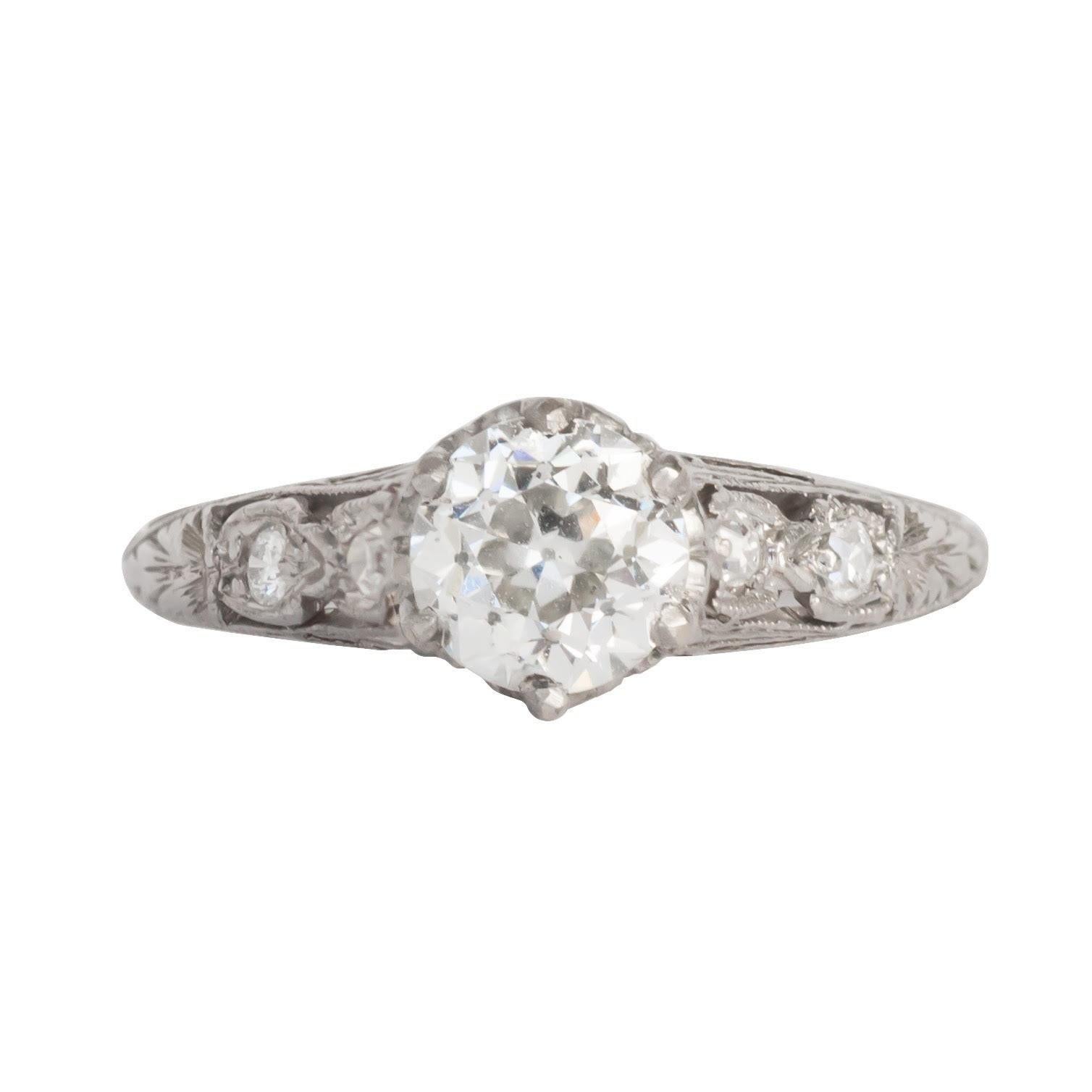Presenting an extraordinary testament to the Edwardian era, this engagement ring stands as an exquisite example of the early 1900s craftsmanship. Remarkably preserved, it exudes the era's intricate detailing and unparalleled charm, having been