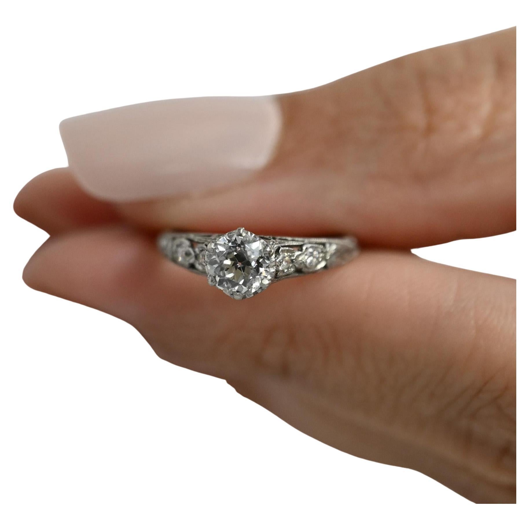 Presenting an extraordinary testament to the Edwardian era, this engagement ring stands as an exquisite example of the early 1900s craftsmanship. Remarkably preserved, it exudes the era's intricate detailing and unparalleled charm, having been