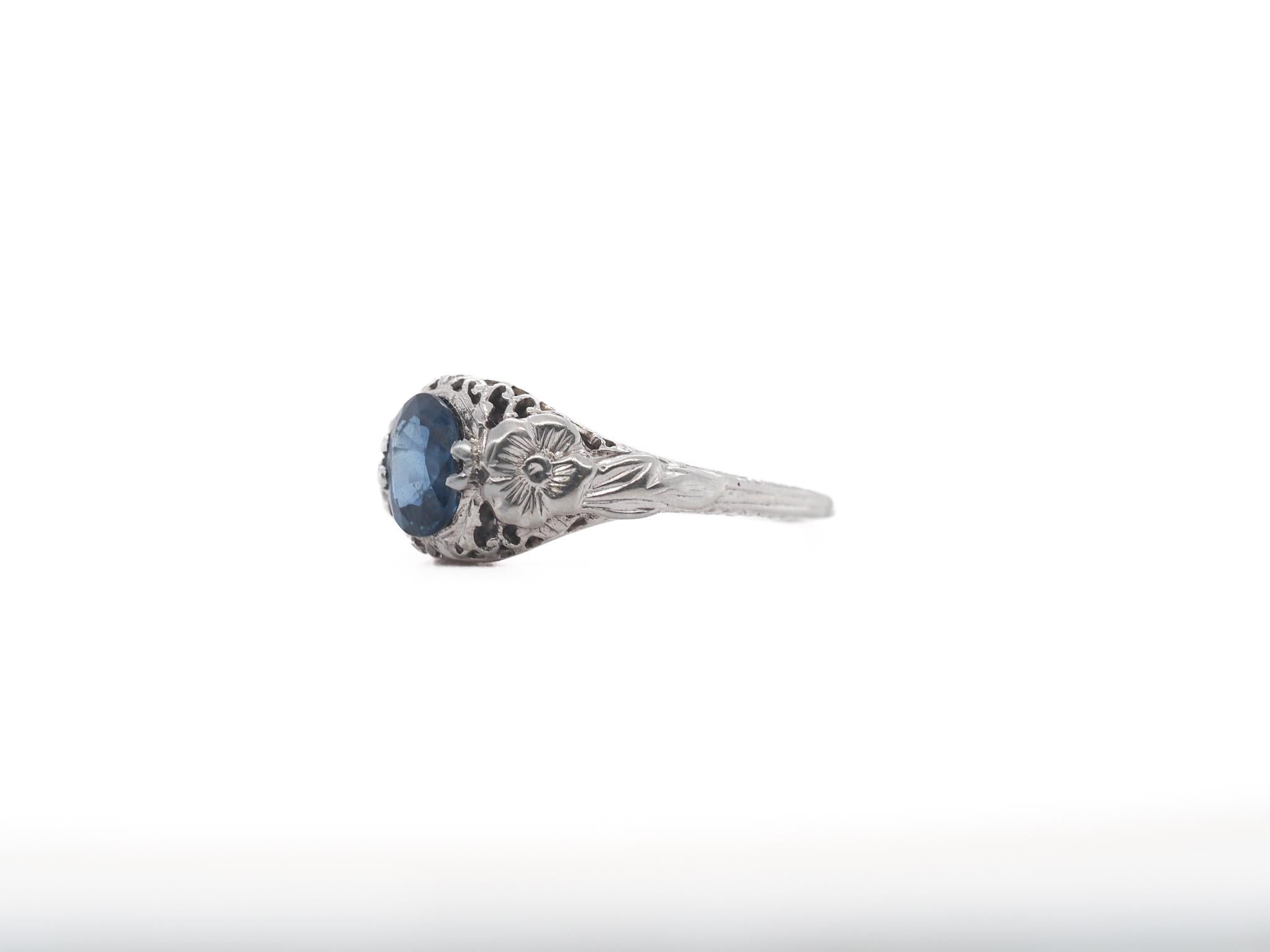 Year: 1910s

Item Details:
Ring Size: 7.25
Metal Type: 18K White Gold [Hallmarked, and Tested]
Weight: 3.3 grams

Center Sapphire Details:

GIA Report#: 6265964048
Weight: 1.08ct total weight
Cut: Antique Oval
Color: Blue
Type: Natural,