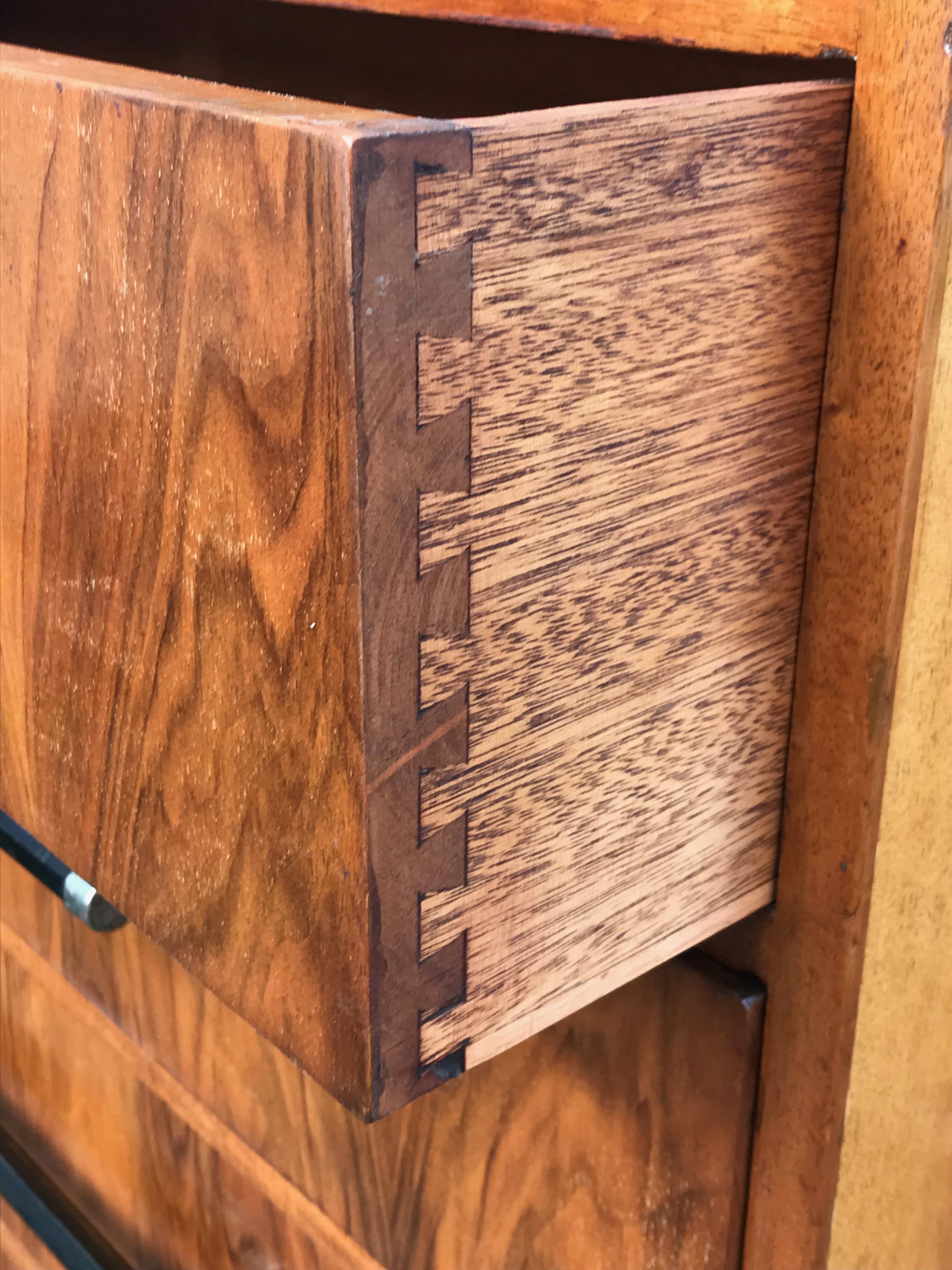 We are pleased to offer you a fabulous Art Deco 1920-1930 chest of drawers in pale figured walnut. A wonderful example having recently been restored in our own workshops. All the drawers have had their runners rebuilt and has been completely re