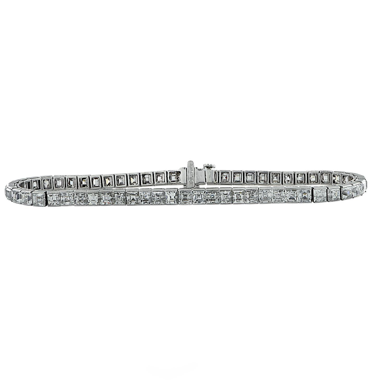 Cira 1920 Art Deco Tiffany & Co Platinum carre cut diamond tennis bracelet featuring 60 carre cut diamonds weighing approximately 8.25 carats total, F-G Color, VS-SI clarity. The bracelet measures 7 inches in length and 3.5mm in width.  The art deco