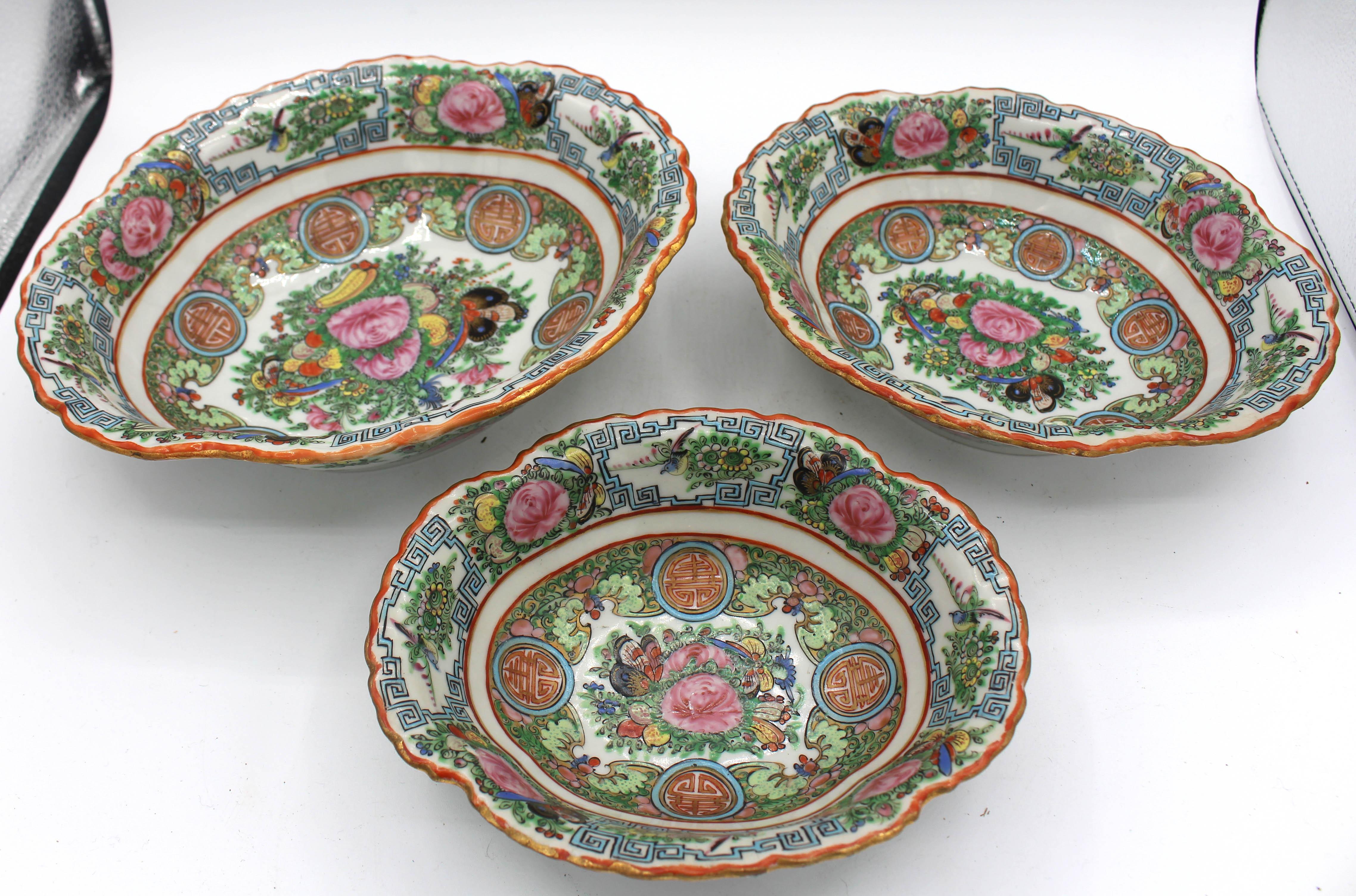 Circa 1920 Chinese Export Rose Canton Nest of 3 Oval Serving Bowls. A rare set. Late Qing to Republic period. Richly enamelled in butterflies, bird & flowers. Marked 