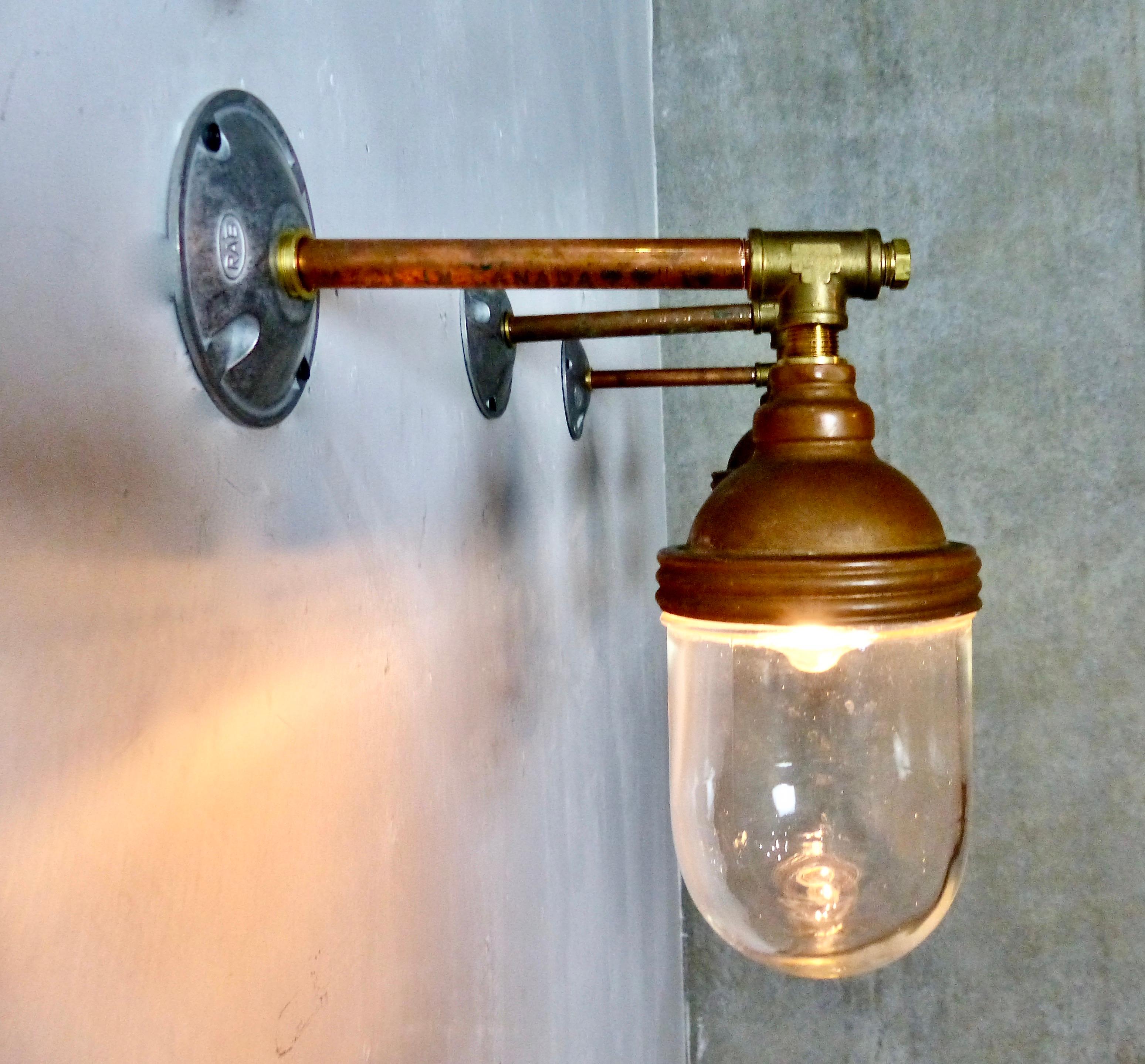 A set of three wall sconces made from Benjamin copper topped lights mounted on copper pipe. A classic industrial look. Wall-mounted lights have been re-wired and inspected and approved to current electrical standards. Price per light.
Dimensions