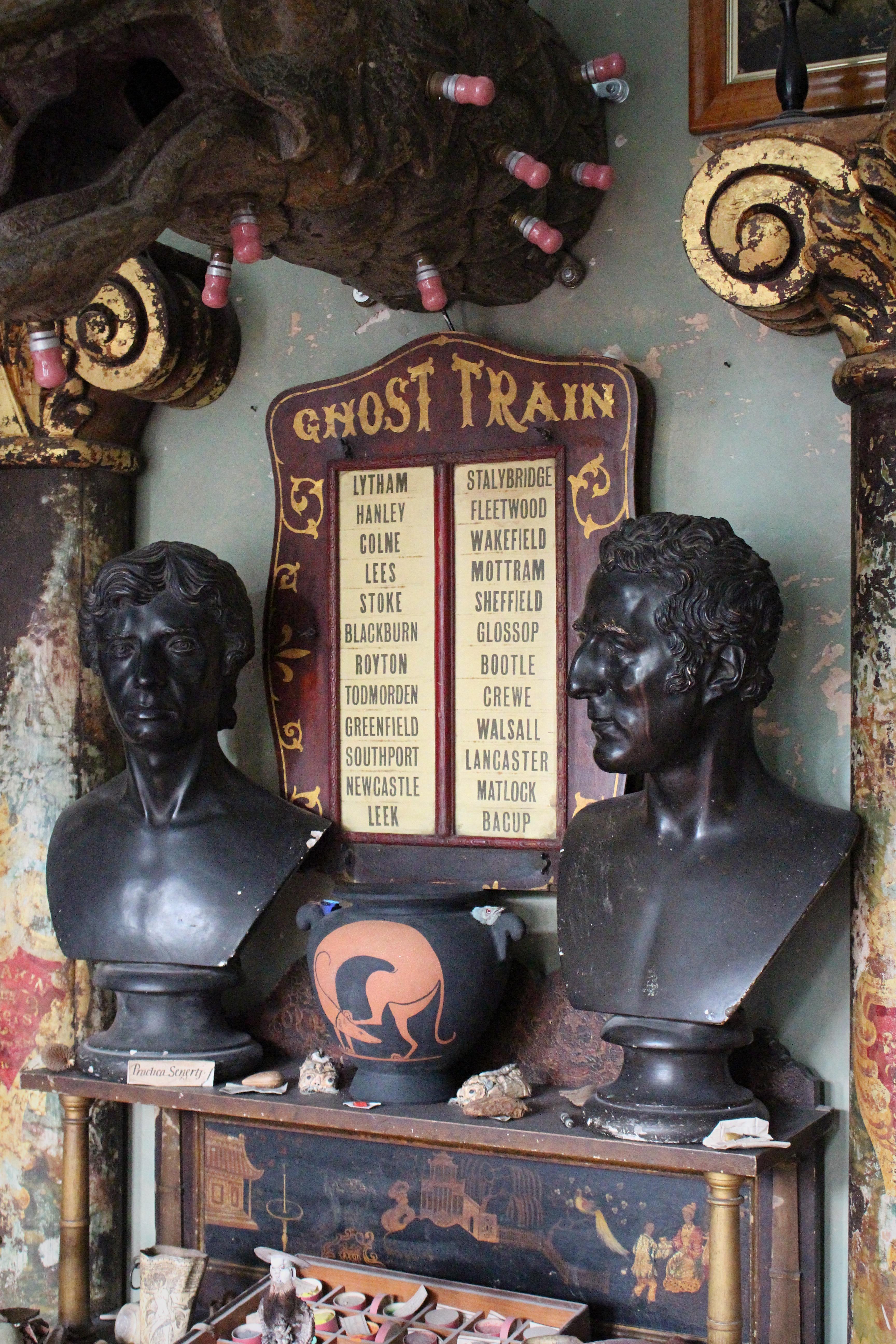 A wonderful and original travelling fairground double sided ghost train destination sign.

Of simple construction, two thin boards sandwich the central box and are fixed with wing nuts, these unscrew so the paper station stops can be removed and
