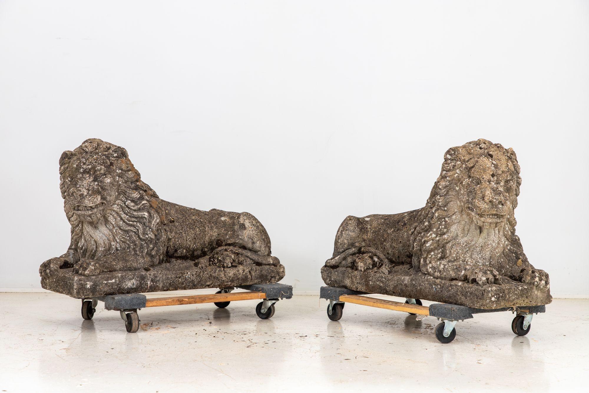 Transport yourself to the opulent grandeur of the early 20th century with this remarkable pair of Circa 1920 English Recumbent Concrete Lions. These large majestic sculptures are a testament to exquisite craftsmanship, capturing every nuance of