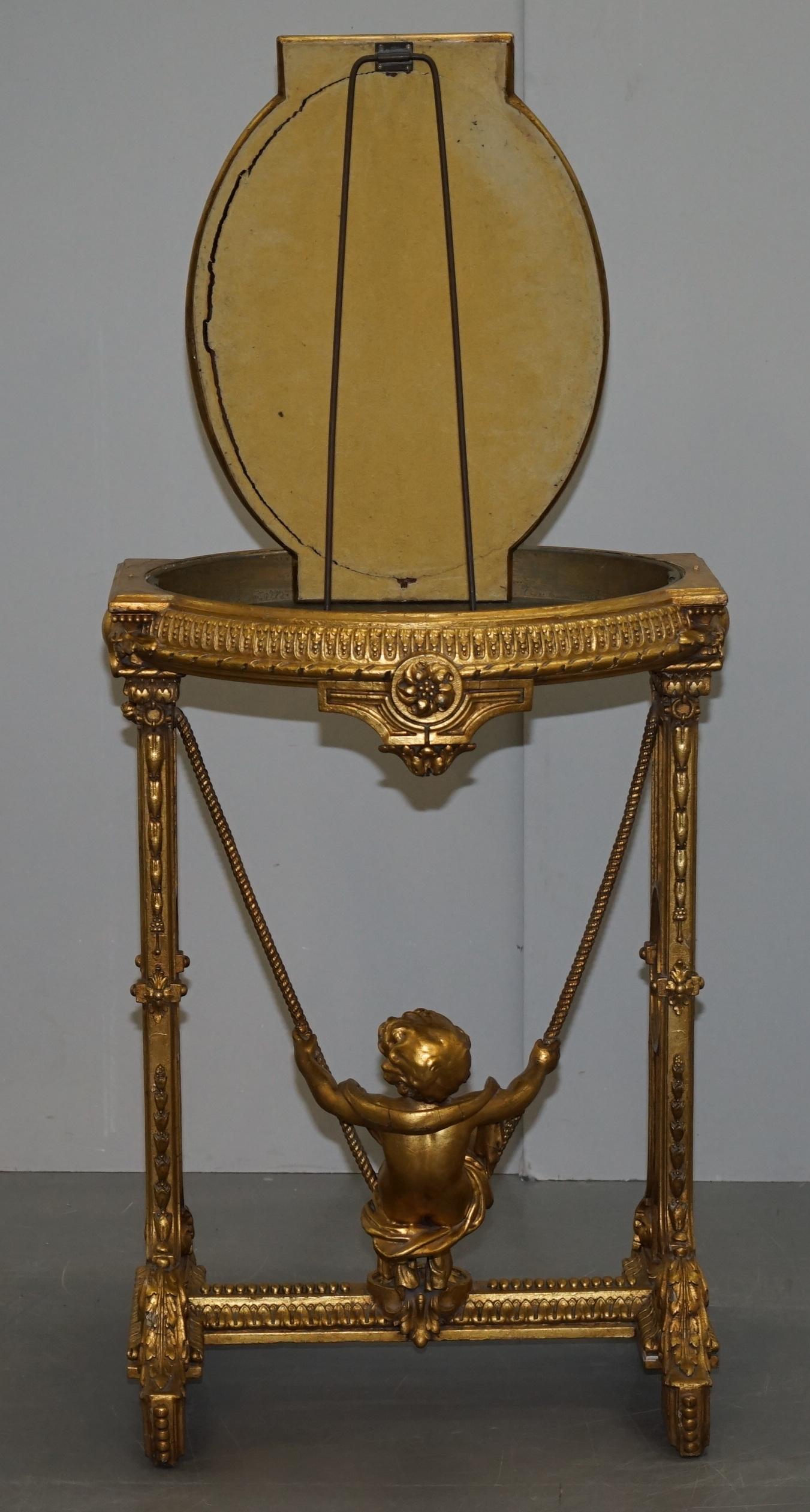 Gold Giltwood Occasional Table with Mirror Top and Cherub Putti Swing circa 1920 For Sale 7