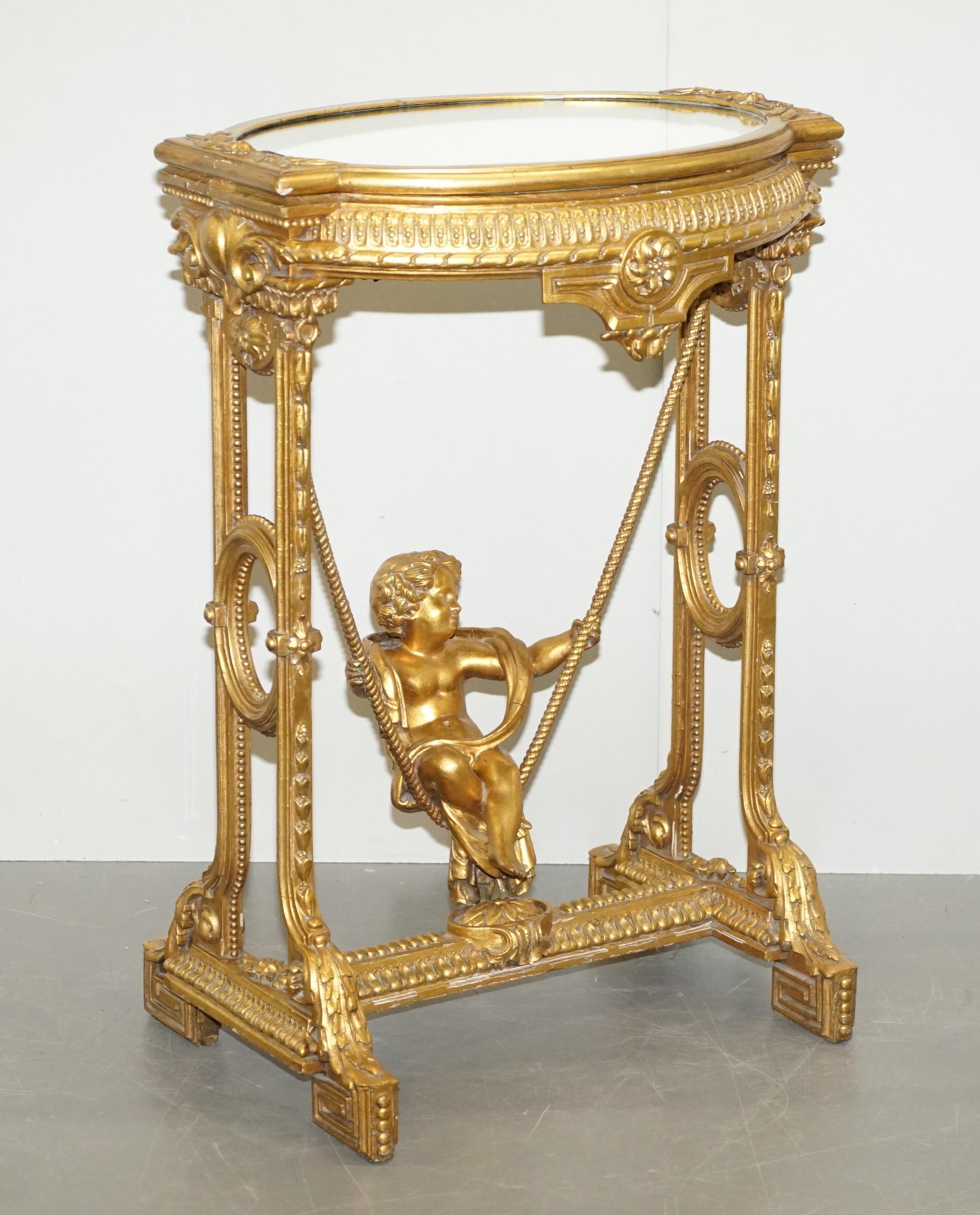 Gold Giltwood Occasional Table with Mirror Top and Cherub Putti Swing circa 1920 For Sale 8