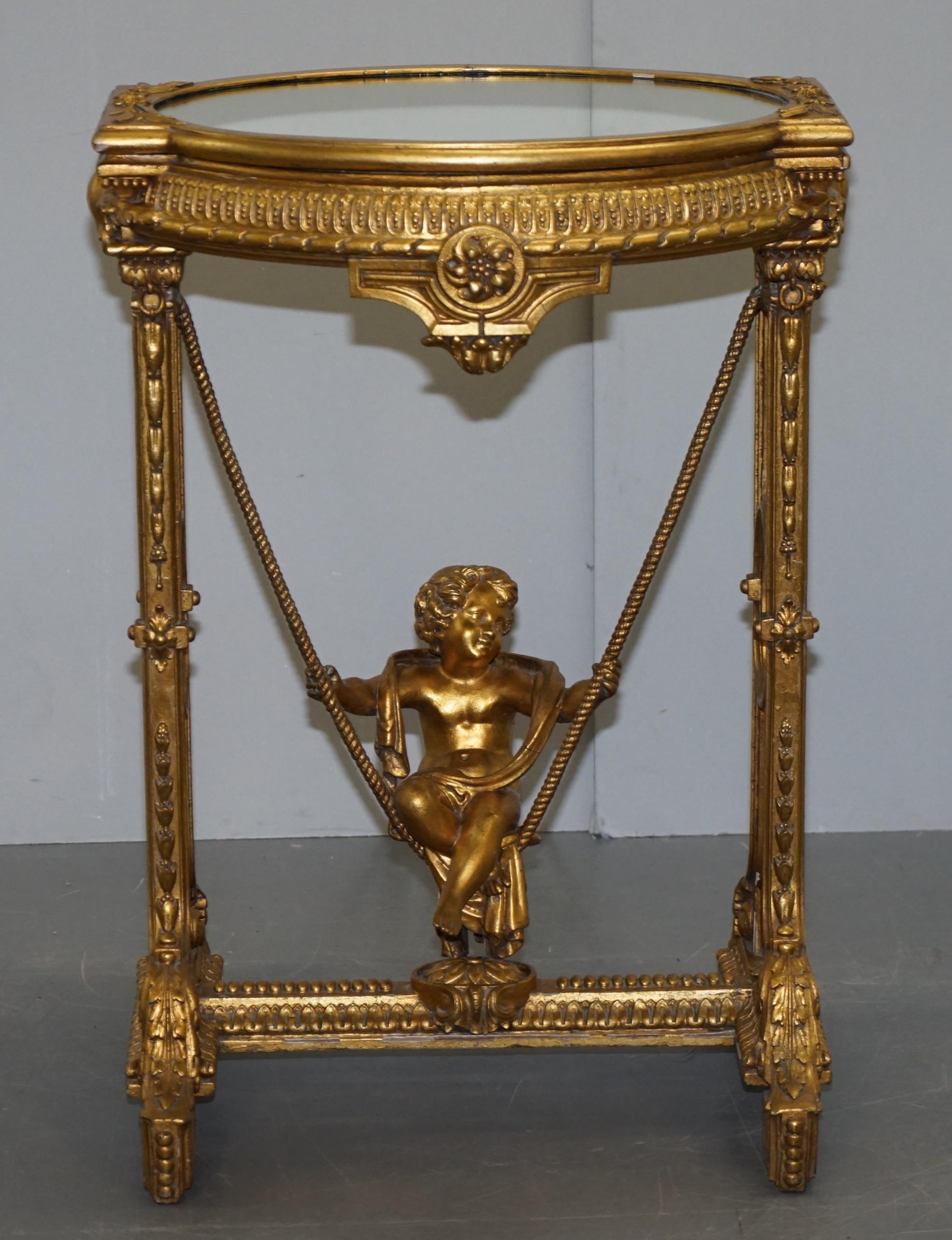 Gold Giltwood Occasional Table with Mirror Top and Cherub Putti Swing circa 1920 For Sale 9