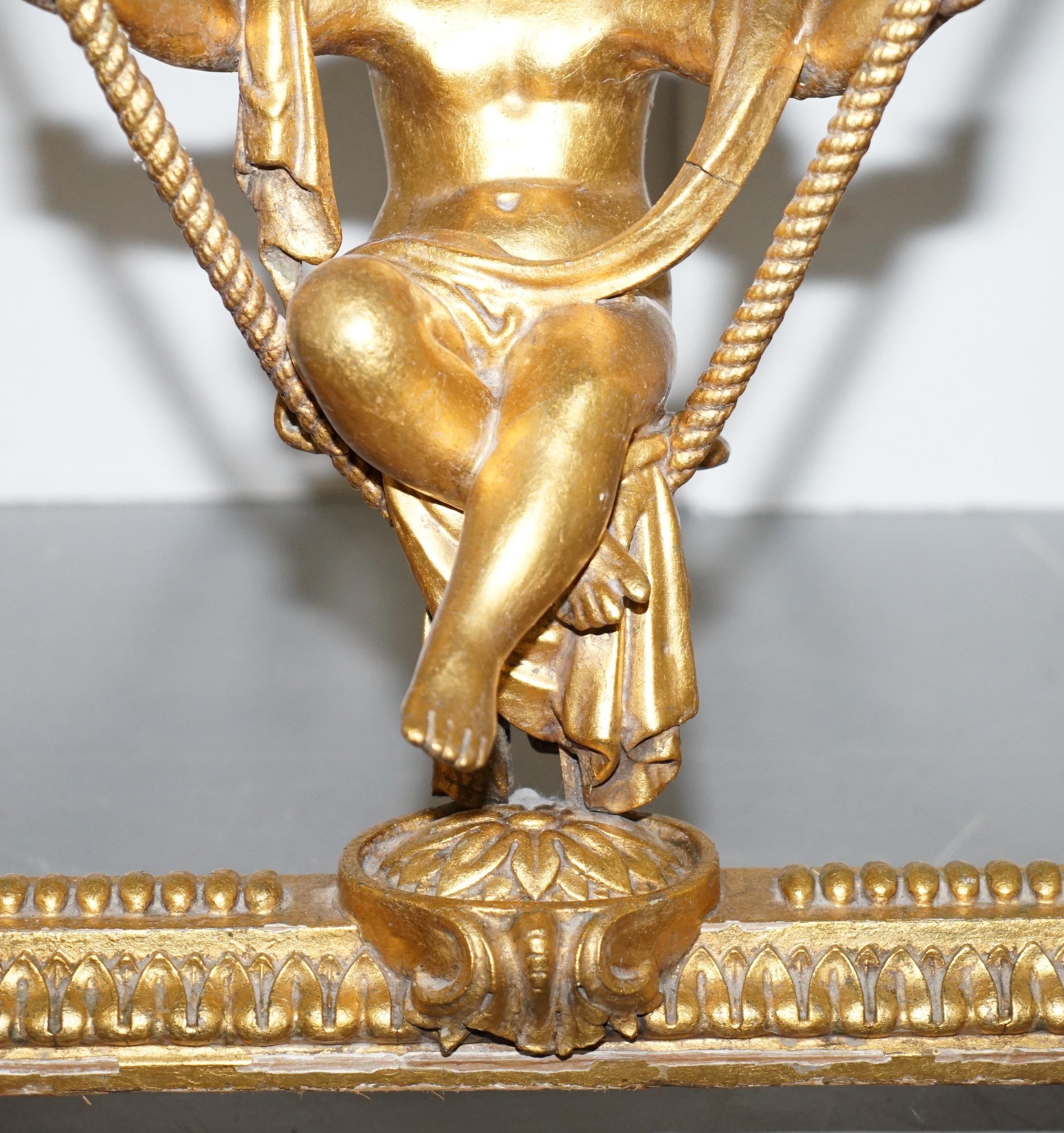 Gold Giltwood Occasional Table with Mirror Top and Cherub Putti Swing circa 1920 For Sale 1