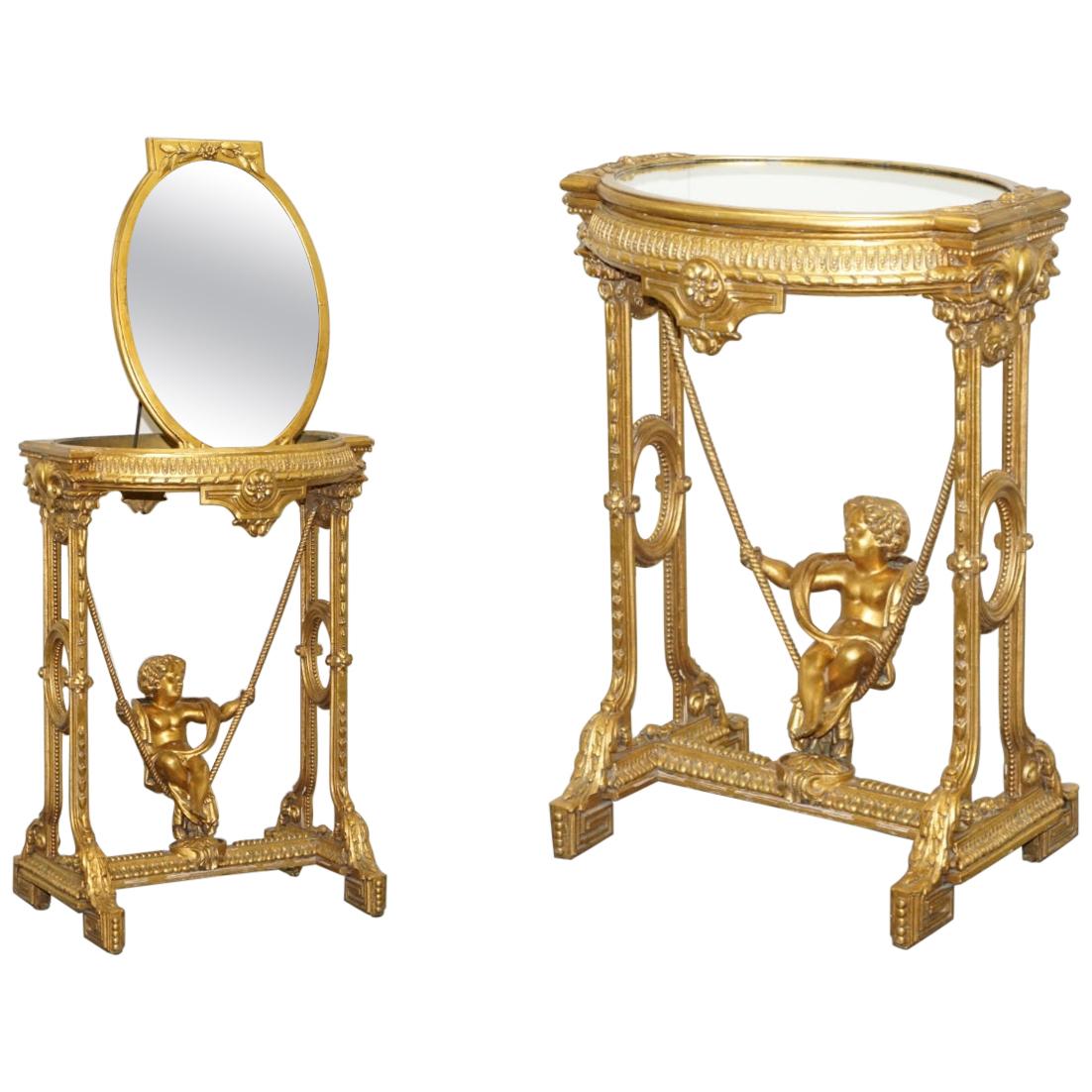 Gold Giltwood Occasional Table with Mirror Top and Cherub Putti Swing circa 1920 For Sale