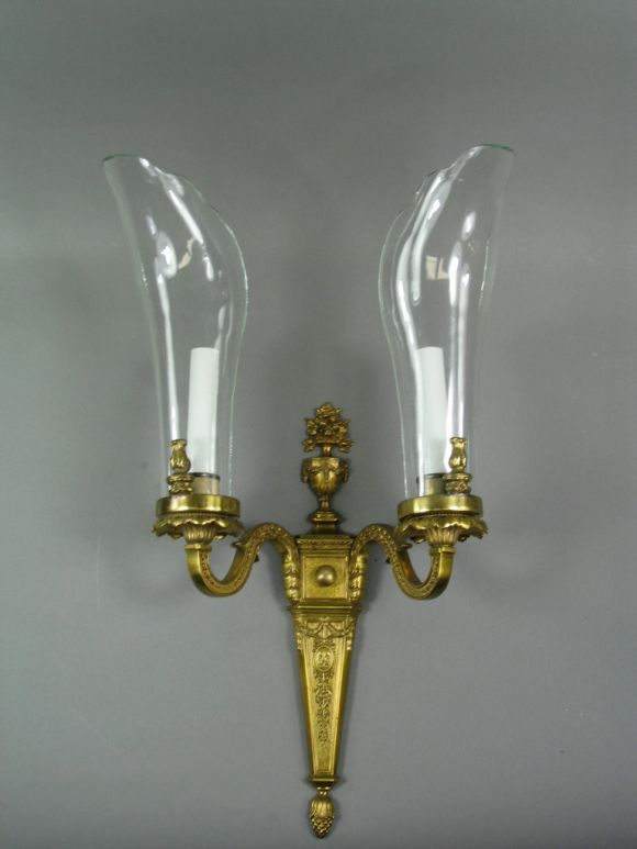 #2-665 2 lite bronze sconces with finely chased detailing with handmade arched crystal  fan shade
2 pair available
Priced per pair.