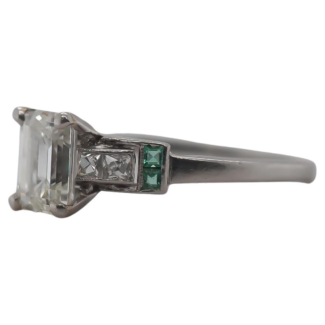 Circa 1920s Antique Emerald Diamond and French Cut Diamond Engagement Ring