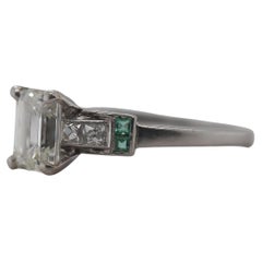 Circa 1920s Antique Emerald Diamond and French Cut Diamond Engagement Ring