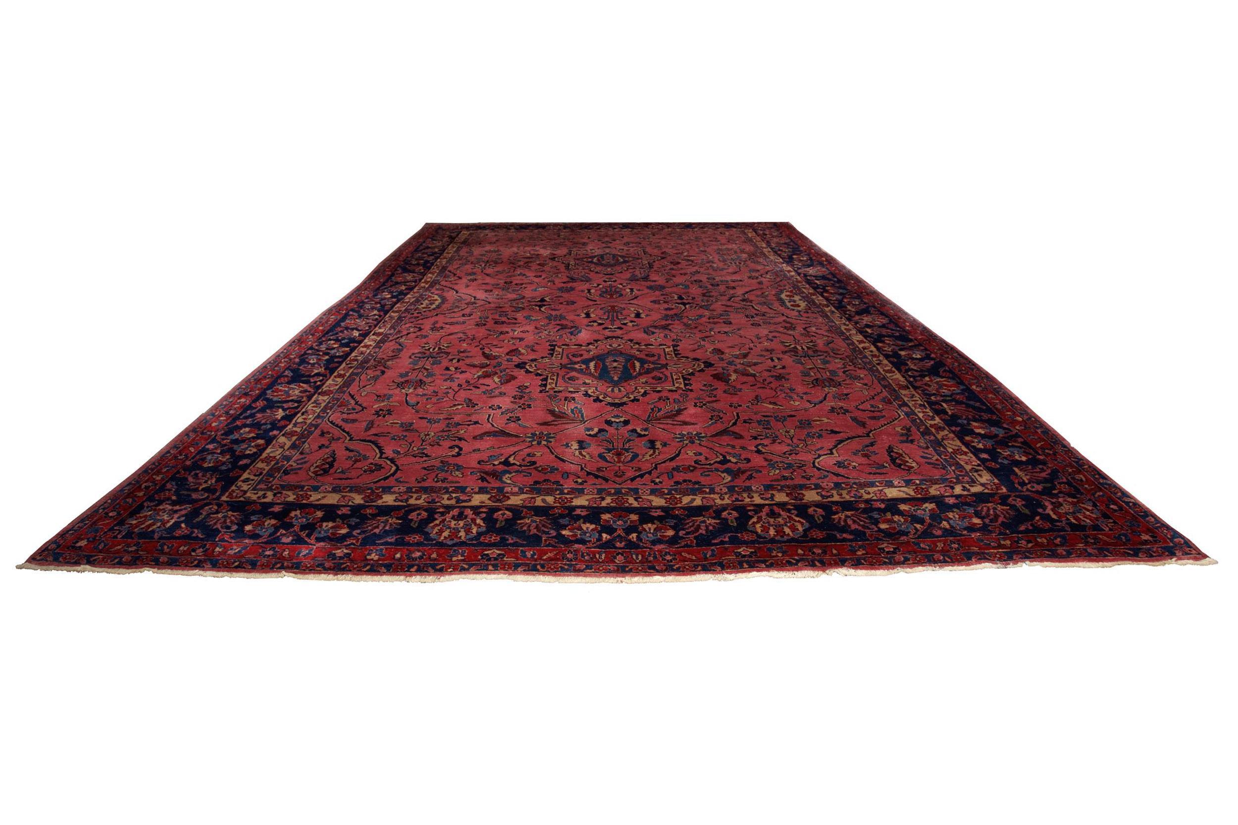 Circa 1920s Antique Room Size Purple Sarouk 13.7' x 9.4'
Item # C1021021

A strong statement piece, this gorgeous room-size Sarouk carpet features a rich overall magenta and purple ground that is most striking. The angular stylized floral designs