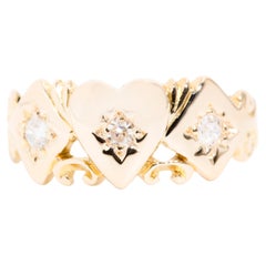Circa 1920s Antique Three Stone Diamond Heart Ring in 15 Carat Yellow Gold