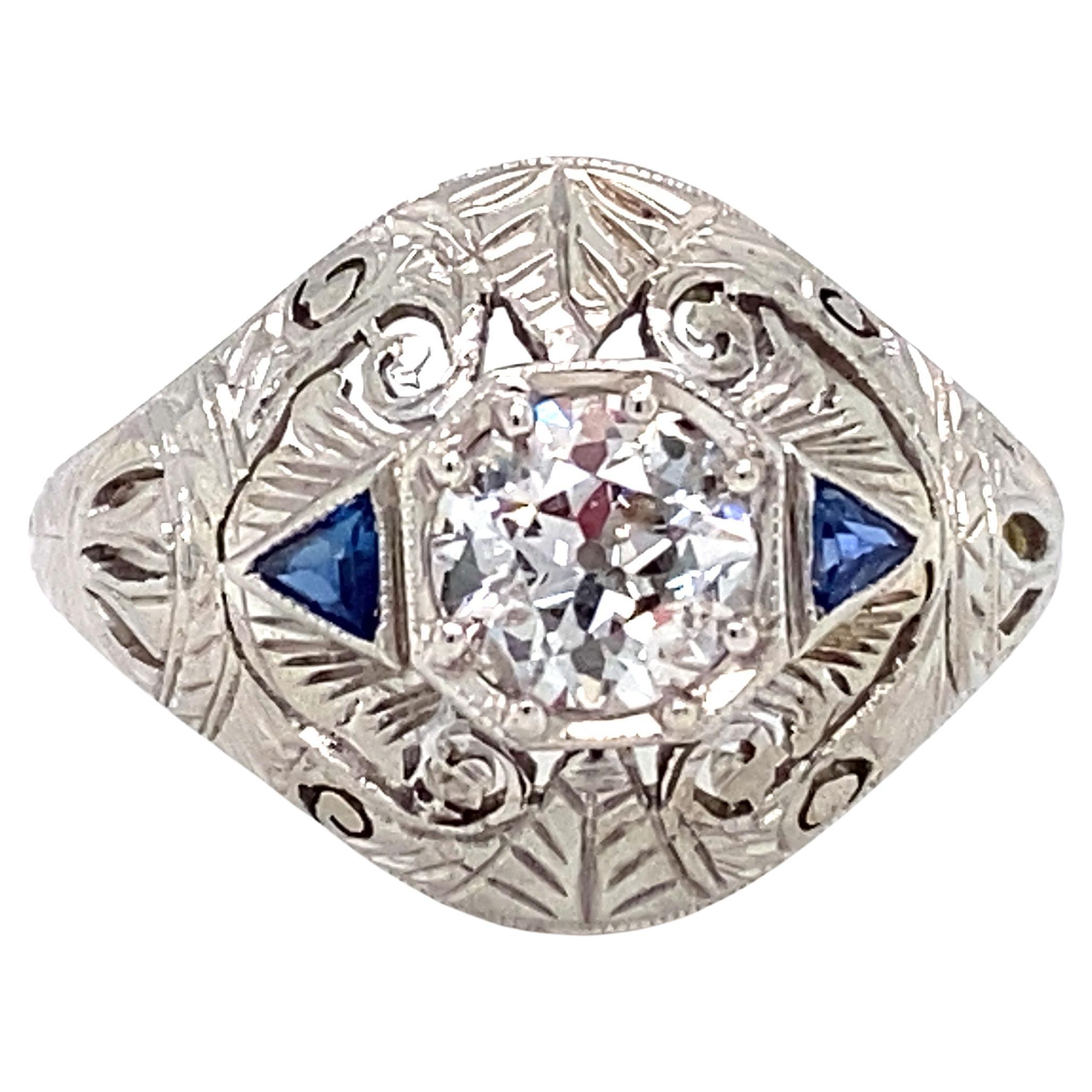 Circa 1920s Art Deco 0.65 Carat Diamond and Sapphire Ring in Platinum For Sale