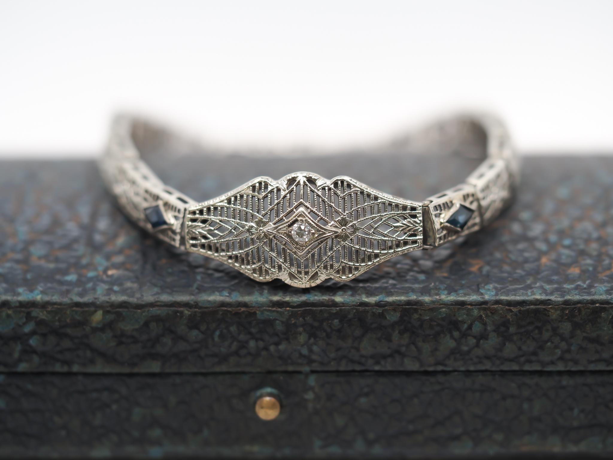 Circa 1920s Art Deco 10K White Gold Filigree Diamond Bracelet In Good Condition For Sale In Hicksville, NY