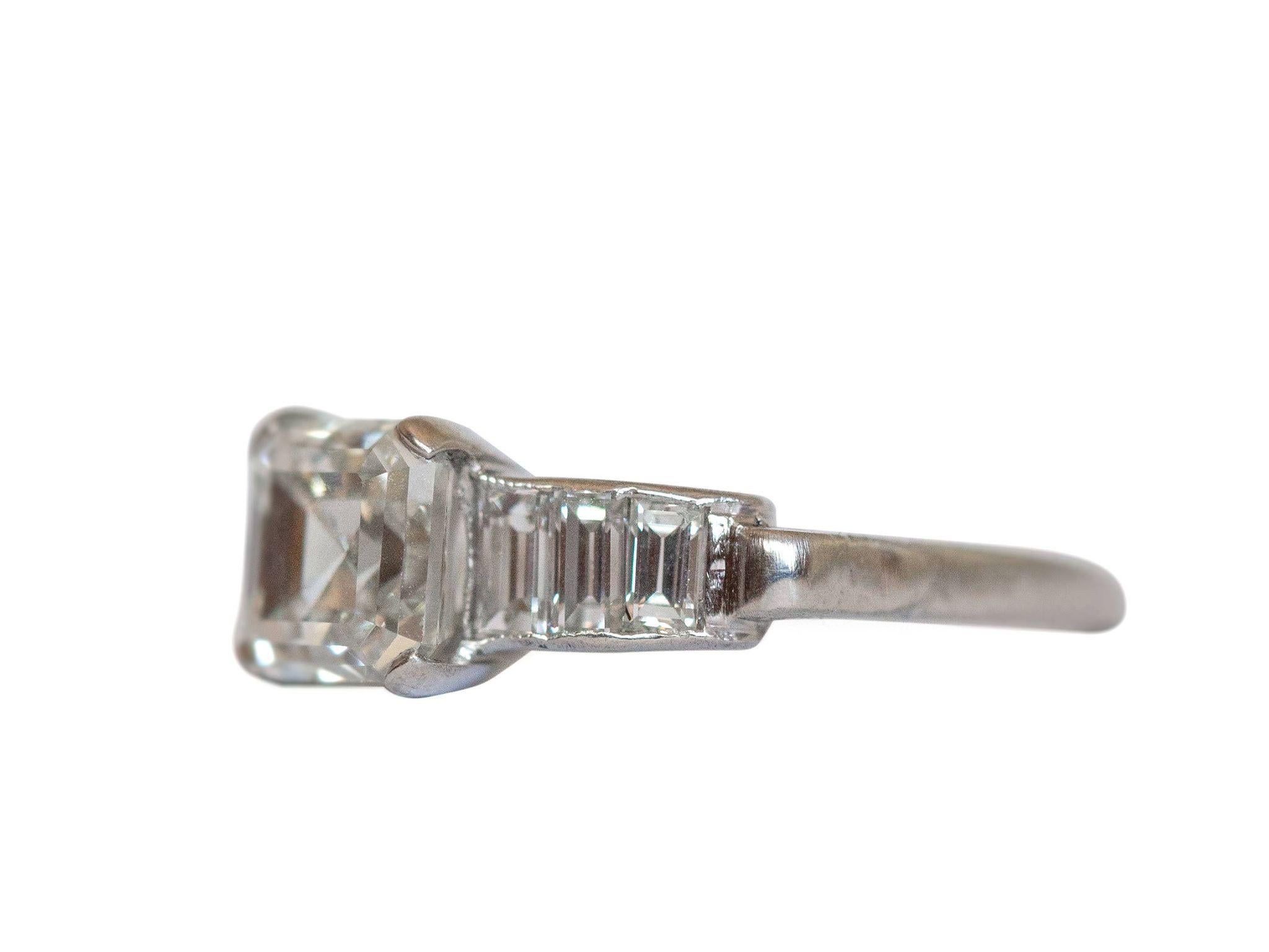 This classic diamond engagement ring features a 1.51 carat GIA Asscher cut diamond set in the center. The stunning center is held in a classic platinum ring with tapering baguette cut diamonds that sparkle from shoulder to shoulder! This simple yet
