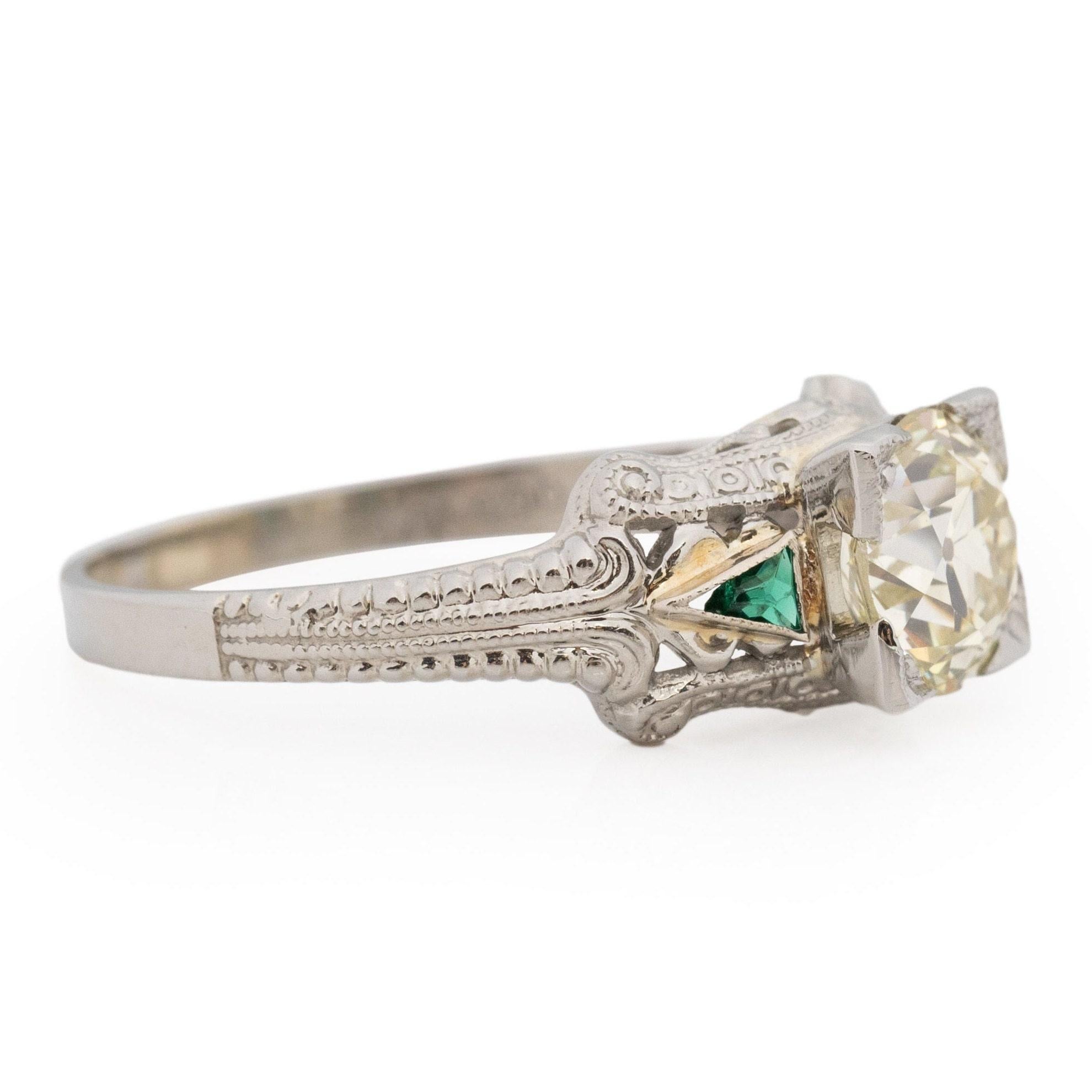 Presenting a splendid illustration of Art Deco craftsmanship, this ring is a true marvel. Its intricate details have been impeccably preserved, showcasing minimal signs of age. Constructed from 18K white gold, the ring's shank tapers gracefully,