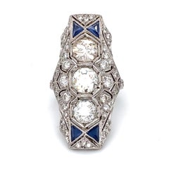 Circa 1920s Art Deco 5.5 Carat Diamond and Sapphire Shield Ring in Platinum